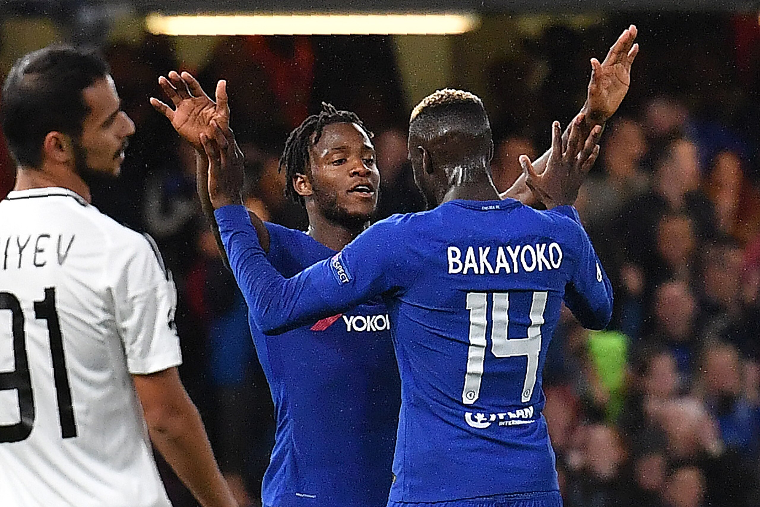 Chelsea's Belgian striker Michy Batshuayi celebrates scoring his team's fifth goal with Chelsea's French midfielder Tiemoue Bakayoko during the UEFA Champions League Group C football match between Chelsea and Qarabag at Stamford Bridge in London on Septem