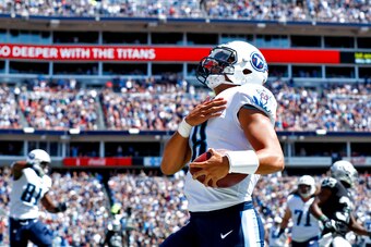 NASHVILLE, TN- SEPTEMBER 10: Quarterback Marcus Mariota  #8 of the Tennessee Titans scores a touchdown against the Oakland Raiders in the first half at Nissan Stadium on September 10, 2017 In Nashville, Tennessee. (Photo by Wesley Hitt/Getty Images) )