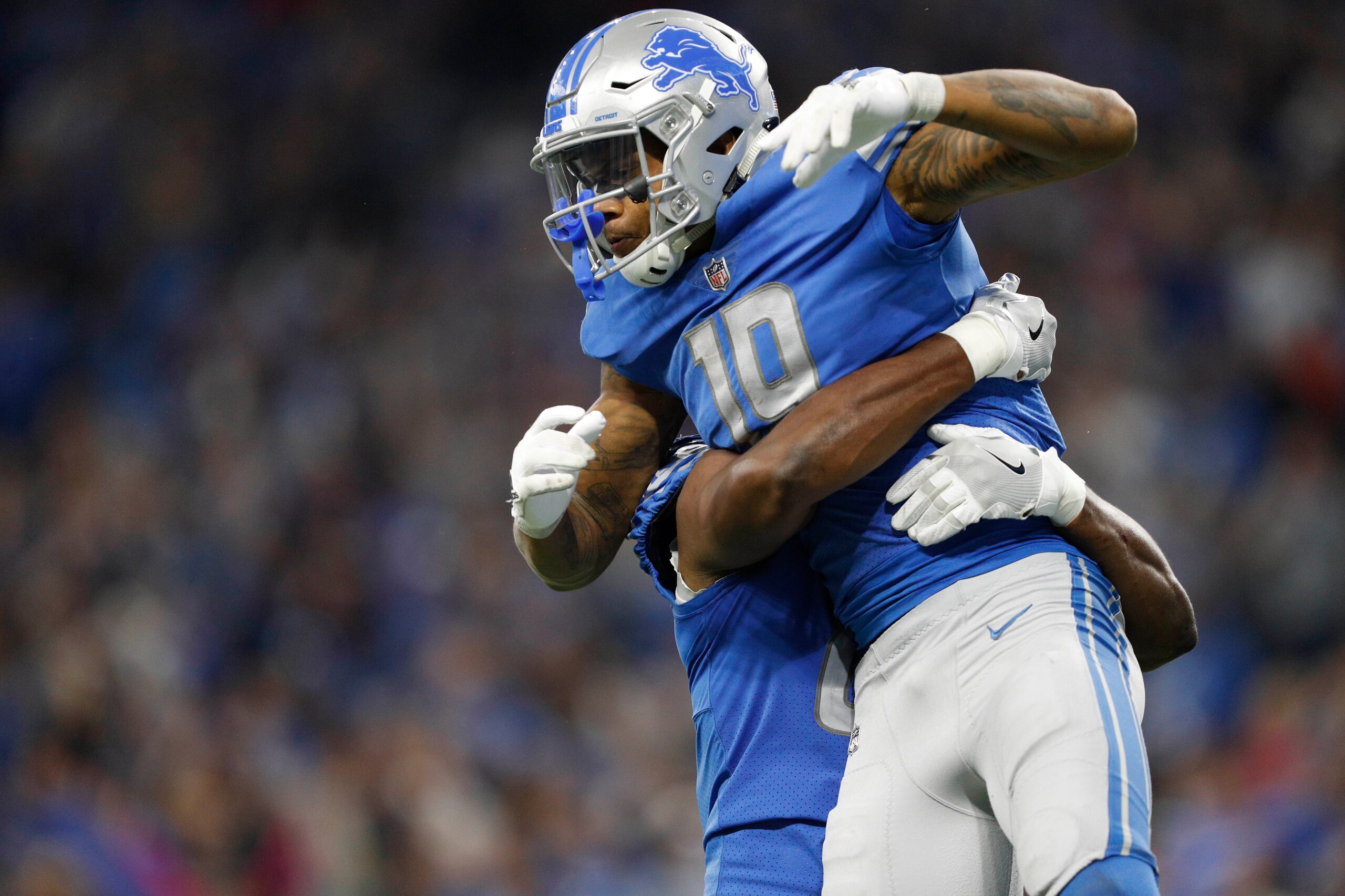 Sep 10, 2017; Detroit, MI, USA; Detroit Lions wide receiver Kenny Golladay (19) celebrates with a teammate after making a touchdown catch during the fourth quarter against the Arizona Cardinals at Ford Field. Mandatory Credit: Raj Mehta-USA TODAY Sports
