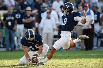 STATESBORO, GA - NOVEMBER 28:  Punter Ryan Nowicki #49 of the Georgia Southern Eagles holds the ball for kicker Younghoe Koo #9 during a field goal attempt against the South Alabama Jaguars during the third quarter on November 28, 2015 at Paulson Stadium 