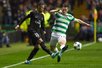 Paris Saint-Germain's Brazilian striker Neymar (L) vies with Celtic's Scottish defender Anthony Ralston during the UEFA Champions League Group B football match between Celtic and Paris Saint-Germain (PSG) at Celtic Park in Glasgow, on September 12, 2017. 