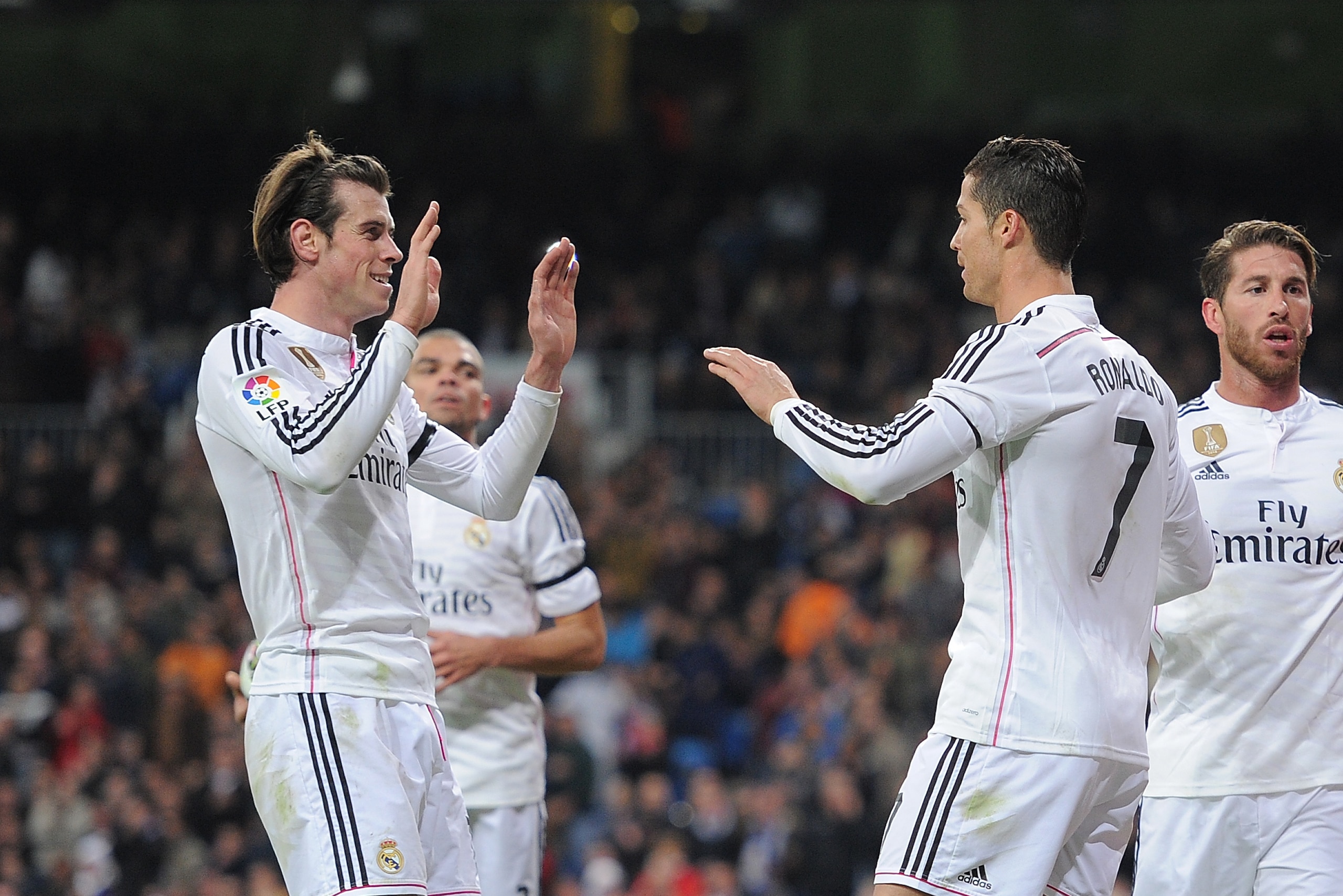 MADRID, SPAIN - MARCH 15: Gareth Bale of Real Madrid celebrates with Cristiano Ronaldo after scoring Real's 2nd goal during the La Liga match between Real Madrid CF and Levante UD at Estadio Santiago Bernabeu on March 15, 2015 in Madrid, Spain. (Photo b MADRID, SPAIN - MARCH 15: Gareth Bale of Real Madrid celebrates with Cristiano Ronaldo after scoring Real's 2nd goal during the La Liga match between Real Madrid CF and Levante UD at Estadio Santiago Bernabeu on March 15, 2015 in Madrid, Spain. (Photo b
