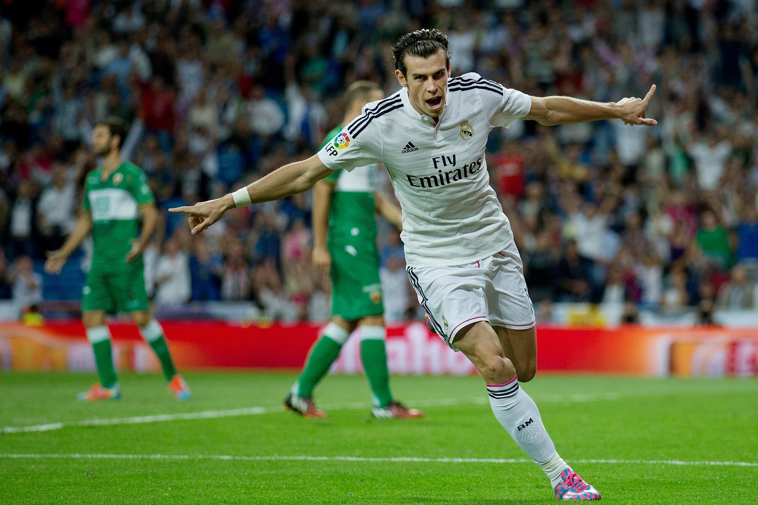 MADRID, SPAIN - SEPTEMBER 23: Gareth Bale of Real Madrid CF celebrates scoring their opening goal during the La Liga match between Real Madrid CF and Elche CF at Estadio Santiago Bernabeu on September 23, 2014 in Madrid, Spain. (Photo by Gonzalo Arroyo MADRID, SPAIN - SEPTEMBER 23: Gareth Bale of Real Madrid CF celebrates scoring their opening goal during the La Liga match between Real Madrid CF and Elche CF at Estadio Santiago Bernabeu on September 23, 2014 in Madrid, Spain. (Photo by Gonzalo Arroyo
