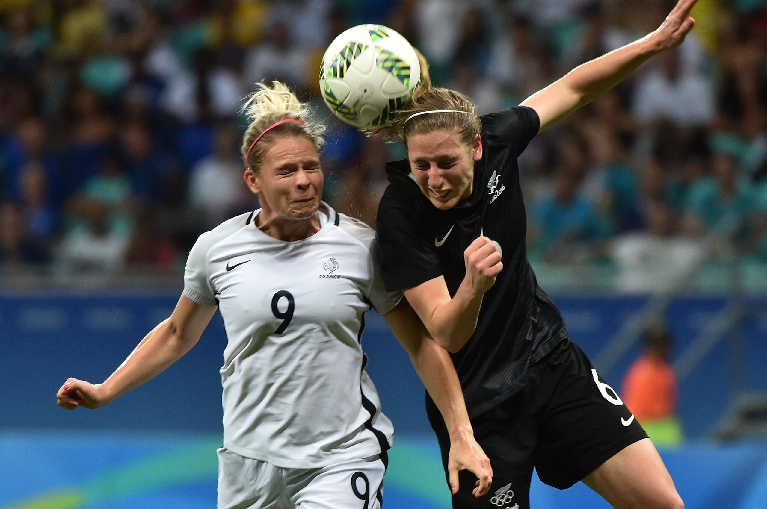 Eugenie Le Sommer (L) of France heads for the ball with Rebekah Stott (R) of New Zealand during their Rio 2016 Olympic Games womens first round Group G football match New Zealand vs France, at the Arena Fonte Nova Stadium in Salvador, Brazil on August 9, 