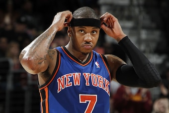 CLEVELAND, OH - FEBRUARY 25:  Carmelo Anthony #7 of the New York Knicks adjusts his head band while playing the Cleveland Cavaliers on February 25, 2011 at the Quicken Loans Arena in Cleveland, Ohio. Cleveland won the game 115-109. NOTE TO USER: User expr