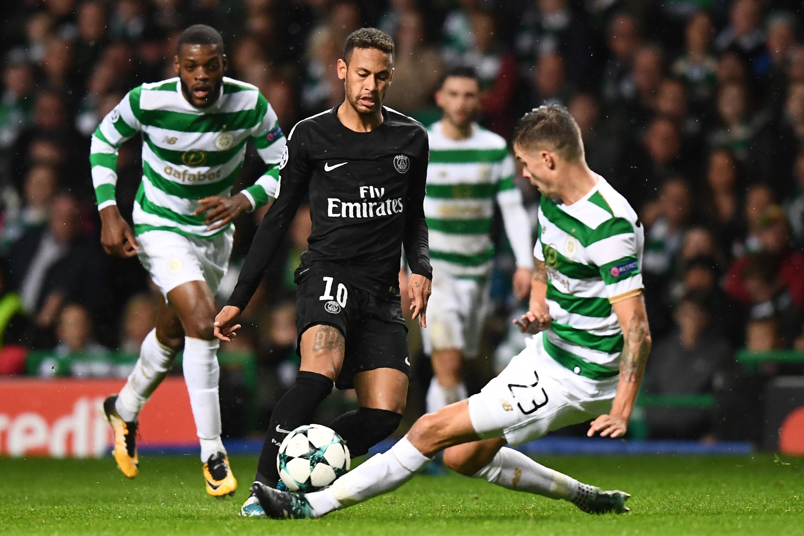Celtic's Swedish defender Mikael Lustig (R) tackles Paris Saint-Germain's Brazilian striker Neymar during the UEFA Champions League Group B football match between Celtic and Paris Saint-Germain (PSG) at Celtic Park in Glasgow, on September 12, 2017. / AFP