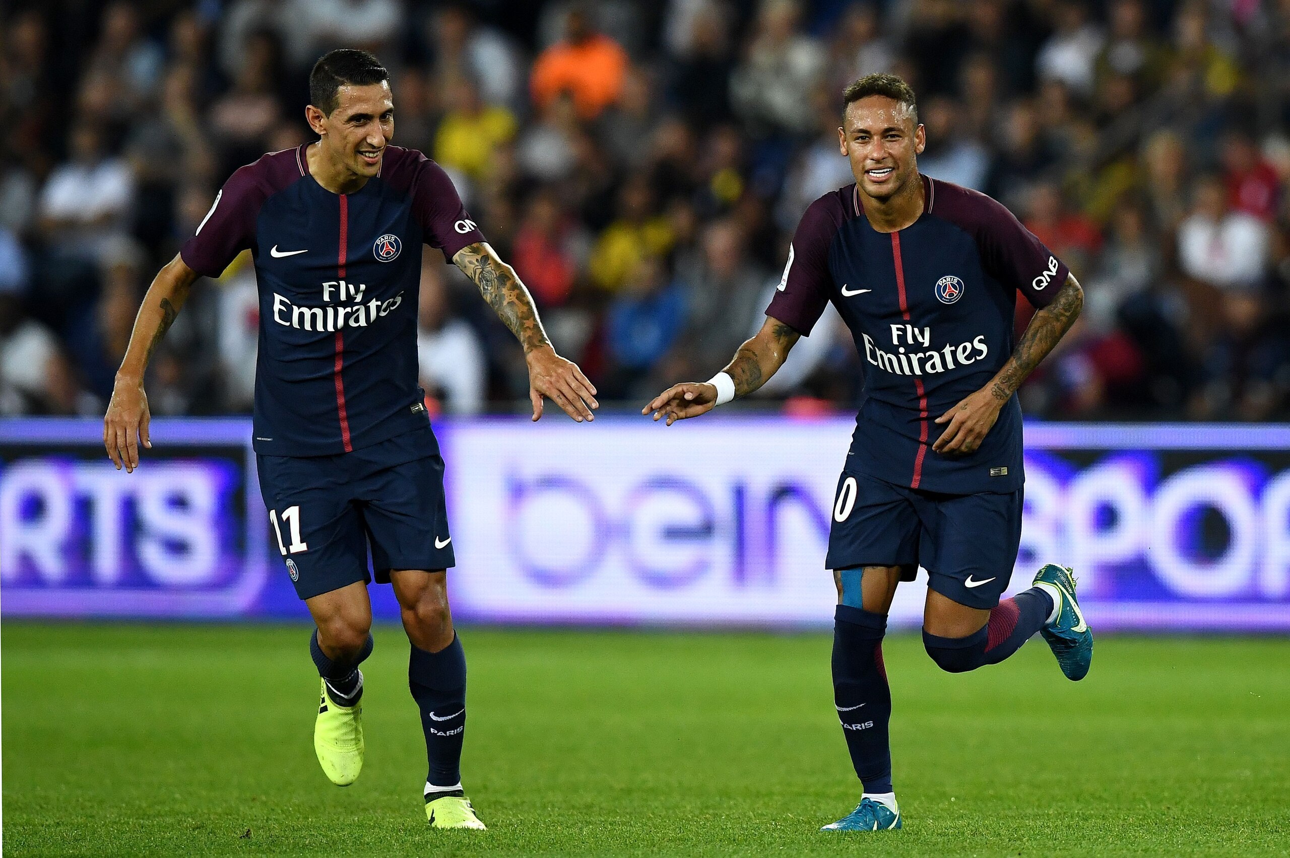 Paris Saint-Germain's Brazilian forward Neymar (R) and di Paris Saint-Germain's Argentinian forward Angel Di Maria (L) react during the French L1 football match between Paris Saint-Germain (PSG) and Saint-Etienne (ASSE) on August 25, 2017, at the Parc des