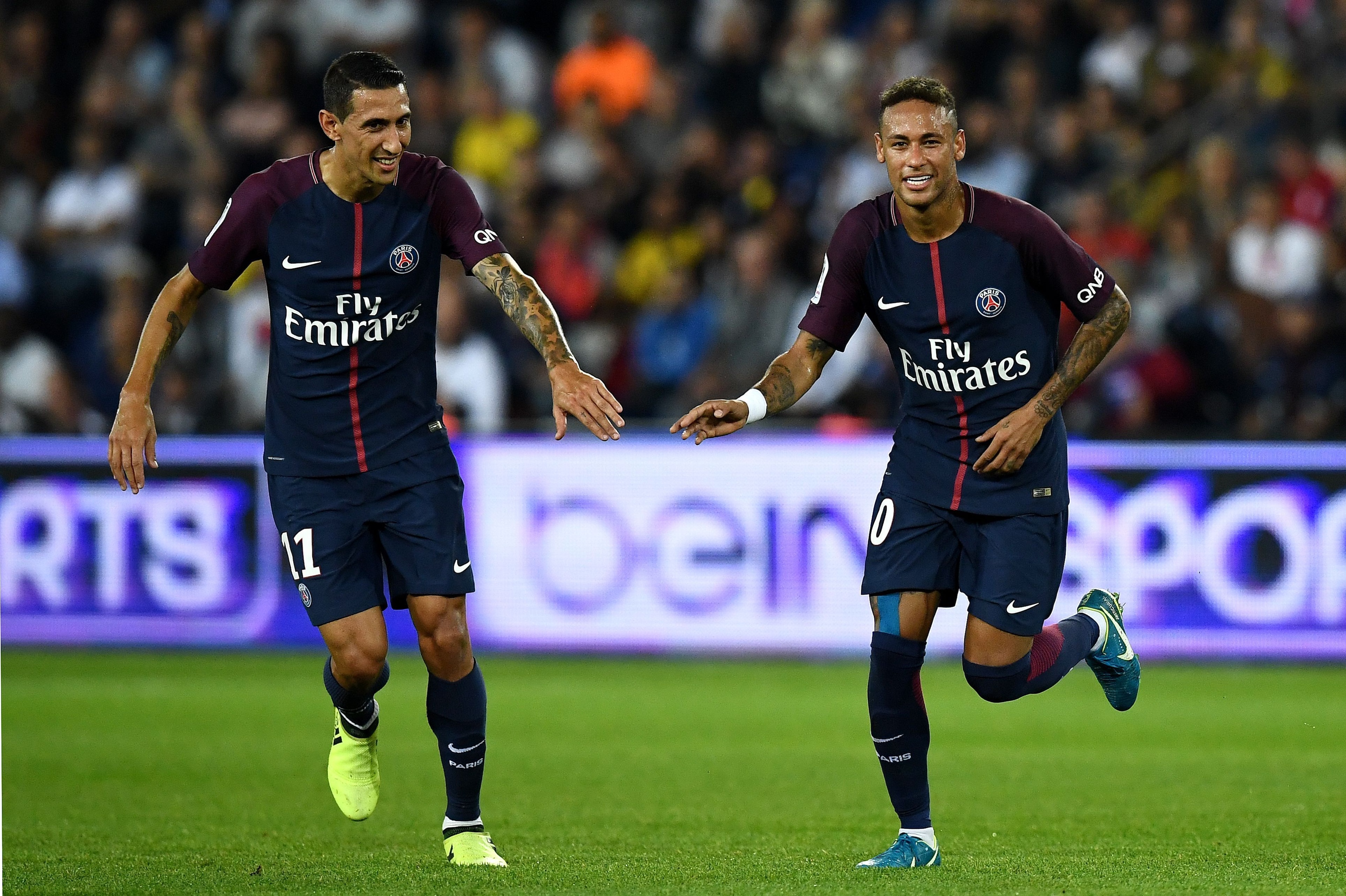 Paris Saint-Germain's Brazilian forward Neymar (R) and di Paris Saint-Germain's Argentinian forward Angel Di Maria (L) react during the French L1 football match between Paris Saint-Germain (PSG) and Saint-Etienne (ASSE) on August 25, 2017, at the Parc des