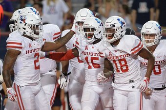 TUCSON, AZ - SEPTEMBER 09:  Wide receiver Linell Bonner #15 of the Houston Cougars celebrates with Duke Catalon #2 and Keith Corbin #18 after scoring a five yard touchdown against the Arizona Wildcats in the first half at Arizona Stadium on September 9, 2