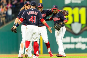 CLEVELAND, OH - SEPTEMBER 12: Infielders Carlos Santana #41; Giovanny Urshela #39 Francisco Lindor #12 and Jose Ramirez #11 of the Cleveland Indians celebrate after the Indians defeated the Detroit Tigers at Progressive Field on September 12, 2017 in Clev