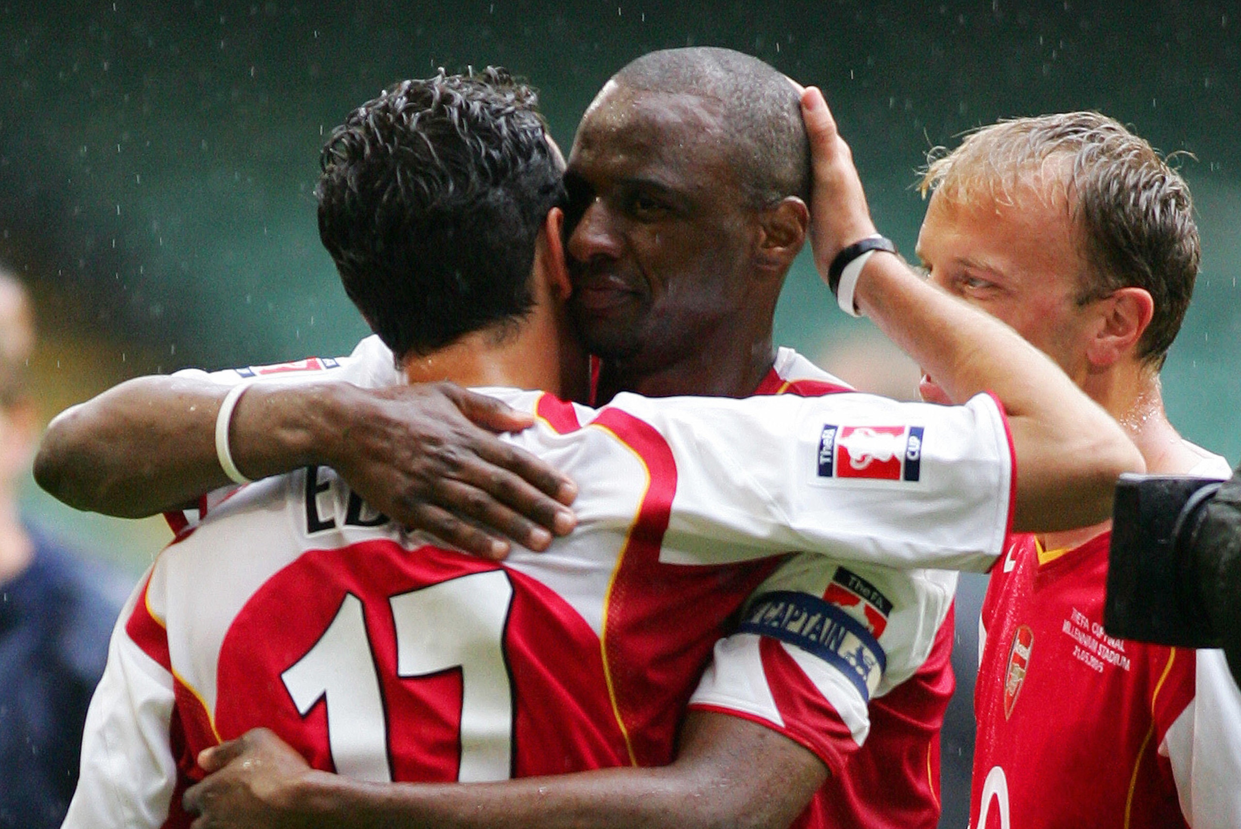 CARDIFF, United Kingdom:  Arsenal's Patrick Vieira (R) hugs Edu after winning the FA Cup Final football match against Manchester United at the Millennium Dome in Cardiff, Wales, 21 May, 2005. The teams tied 0-0 with Arsenal winning 5-4 on penalties.      