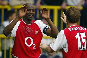 LONDON, UNITED KINGDOM:  Arsenal's French captain Patrick Vieira (L) celebrates his goal against Tottenham with teammate Ray Parlour (R) during their Premier League clash at White Hart Lane in north London, 25 April 2004. Arsenal leads 1-0 and if the resu