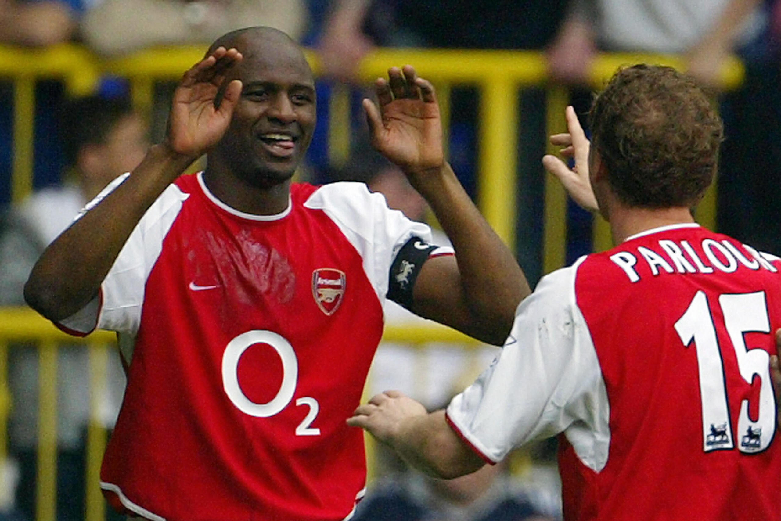 LONDON, UNITED KINGDOM:  Arsenal's French captain Patrick Vieira (L) celebrates his goal against Tottenham with teammate Ray Parlour (R) during their Premier League clash at White Hart Lane in north London, 25 April 2004. Arsenal leads 1-0 and if the resu