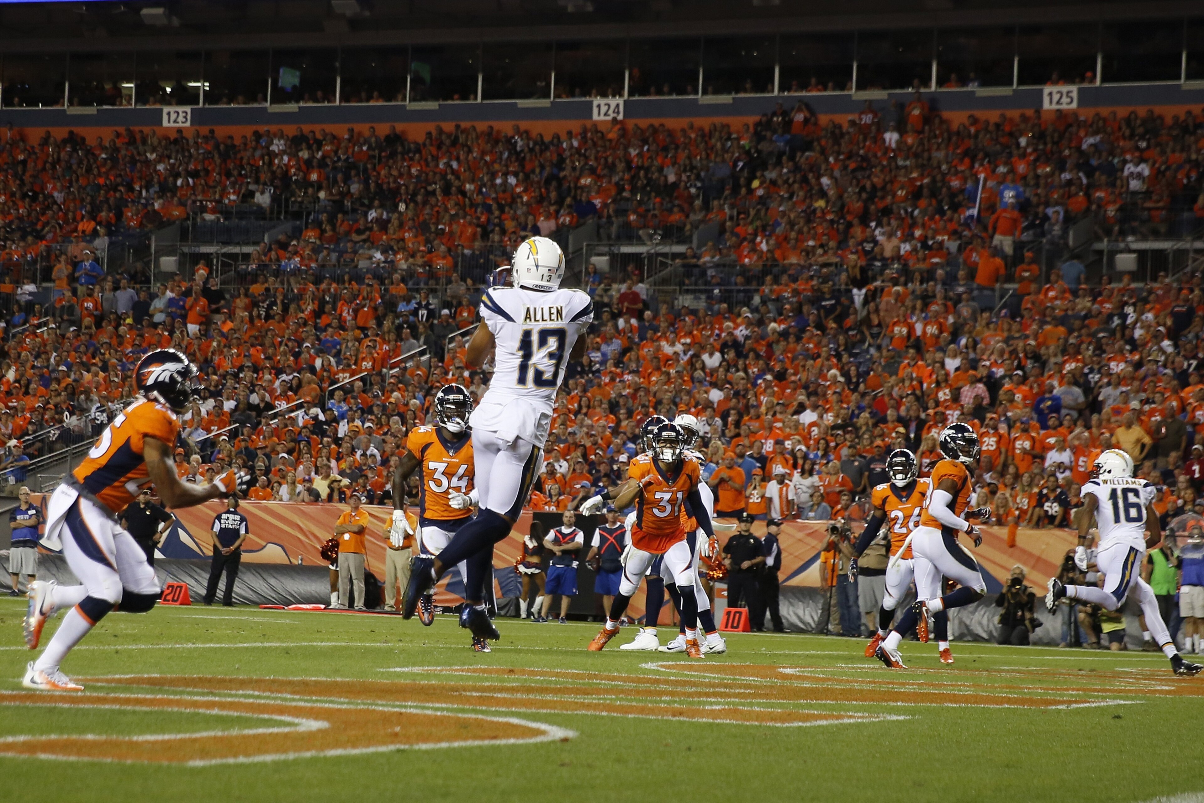 DENVER, CO - SEPTEMBER 11:  Wide receiver Keenan Allen #13 of the Los Angeles Chargers catches a touchdown pass in the fourth quarter of the game against the Denver Broncos at Sports Authority Field at Mile High on September 11, 2017 in Denver, Colorado. 