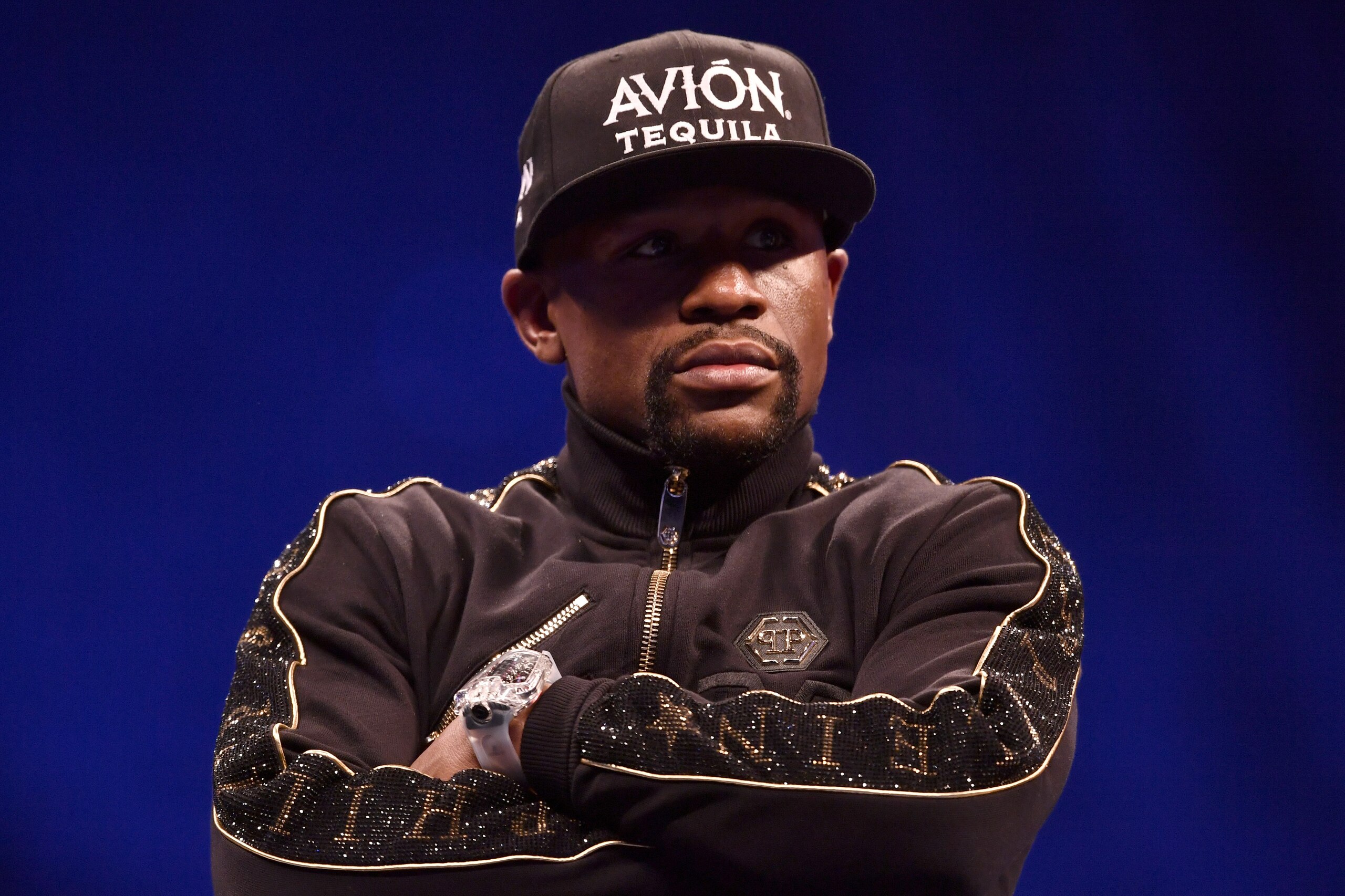 LAS VEGAS, NV - AUGUST 25:  Floyd Mayweather Jr. sits onstage during a news conference after Mayweather's 10th-round TKO victory in their super welterweight boxing match on August 26, 2017 at T-Mobile Arena in Las Vegas, Nevada. (Photo by Jeff Bottari/Zuf
