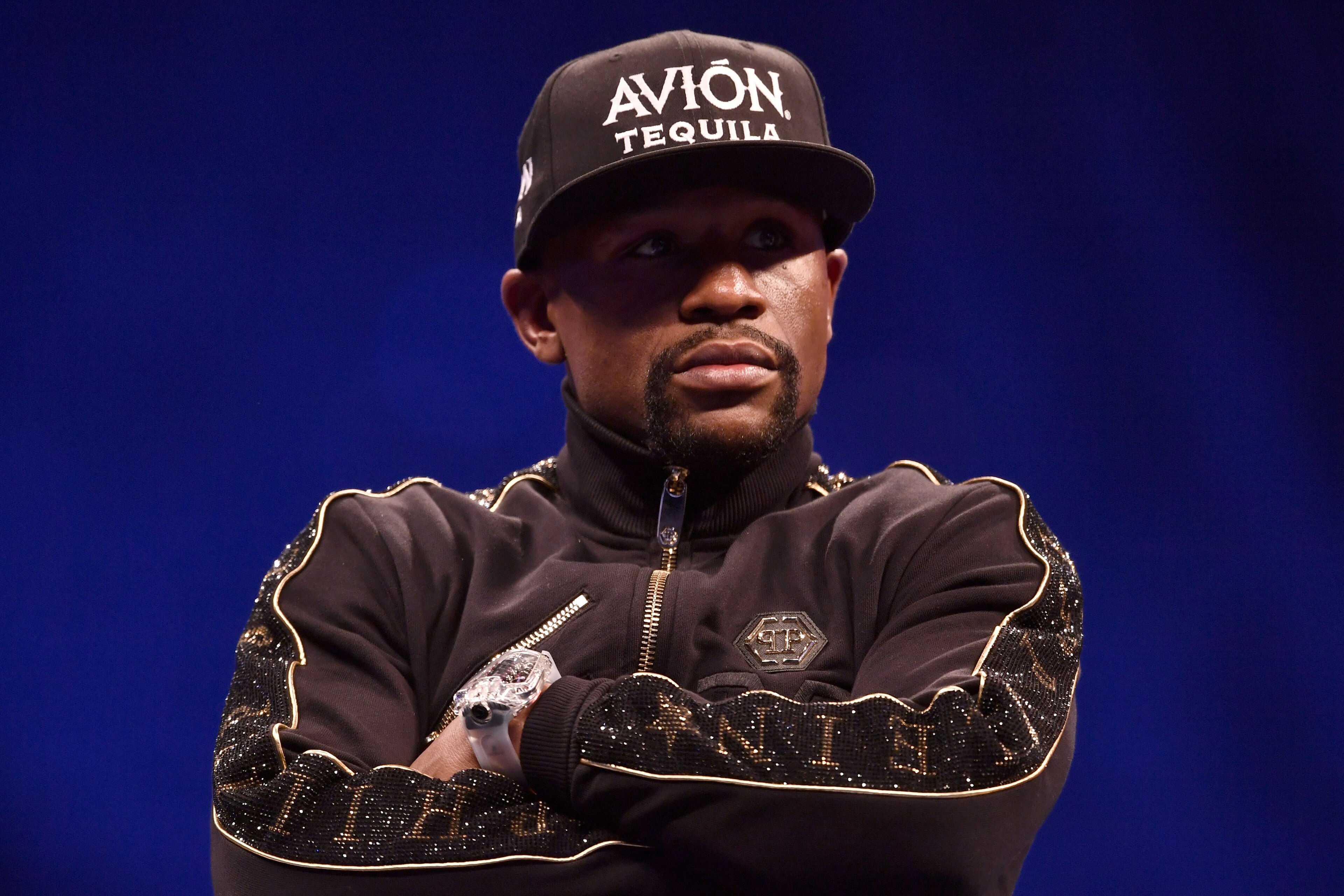 LAS VEGAS, NV - AUGUST 25:  Floyd Mayweather Jr. sits onstage during a news conference after Mayweather's 10th-round TKO victory in their super welterweight boxing match on August 26, 2017 at T-Mobile Arena in Las Vegas, Nevada. (Photo by Jeff Bottari/Zuf