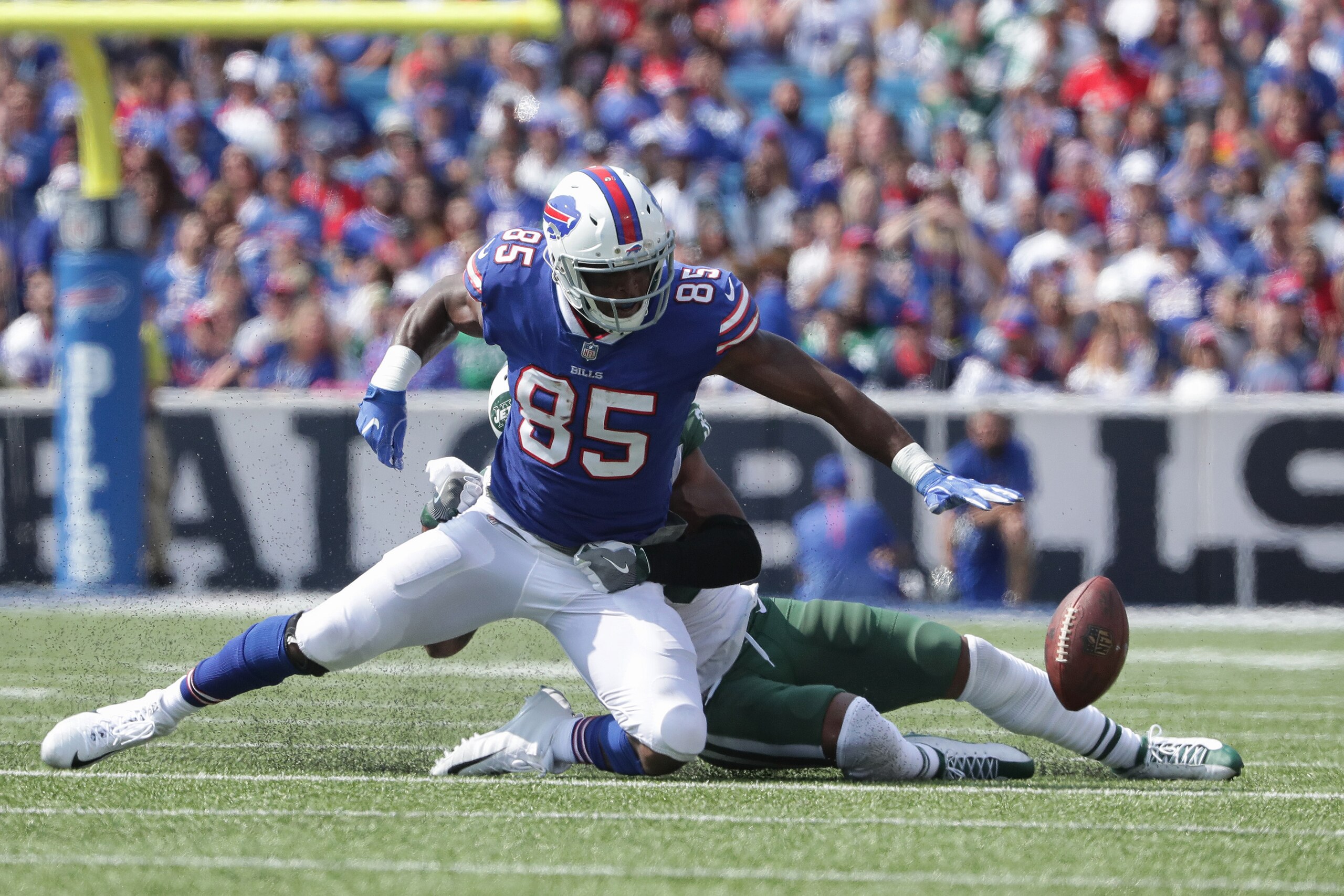 BUFFALO, NY - SEPTEMBER 10: Charles Clay #85 of the Buffalo Bills fumbles the ball during NFL game action as he is hit by Jamal Adams #33 of the New York Jets at New Era Field on September 10, 2017 in Buffalo, New York. (Photo by Tom Szczerbowski/Getty Im