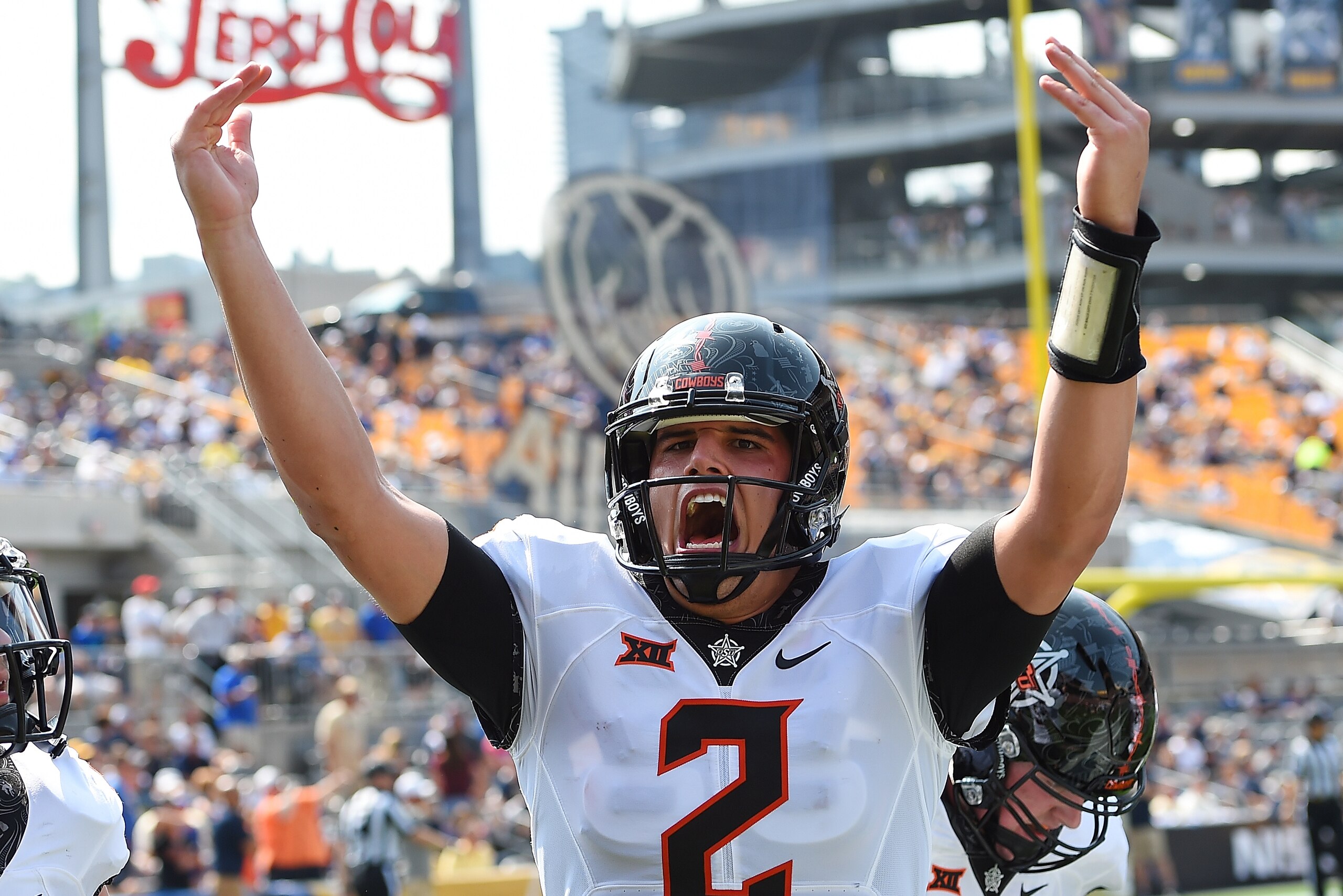 PITTSBURGH, PA - SEPTEMBER 16: Mason Rudolph #2 of the Oklahoma State Cowboys celebrates after a touchdown by Dillon Stoner #17 (not pictured) during the first quarter against the Pittsburgh Panthers at Heinz Field on September 16, 2017 in Pittsburgh, Pen