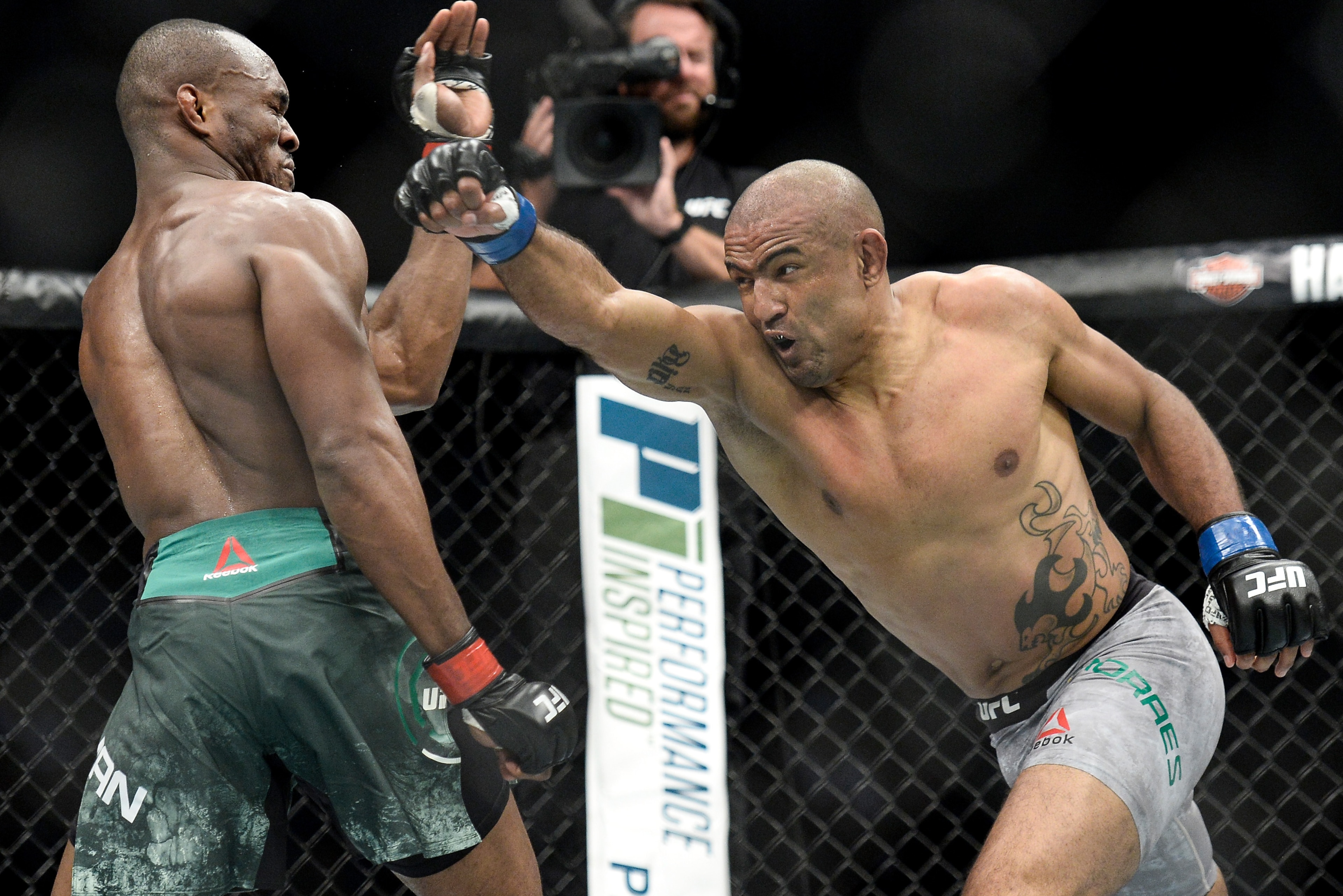 PITTSBURGH, PA - SEPTEMBER 16: (R-L) Sergio Moraes of Brasil punches Kamaru Usman of Nigeriain their welterweight bout during the UFC Fight Night event inside the PPG Paints Arena on September 16, 2017 in Pittsburgh, Pennsylvania. (Photo by Brandon Magnu PITTSBURGH, PA - SEPTEMBER 16: (R-L) Sergio Moraes of Brasil punches Kamaru Usman of Nigeriain their welterweight bout during the UFC Fight Night event inside the PPG Paints Arena on September 16, 2017 in Pittsburgh, Pennsylvania. (Photo by Brandon Magnu