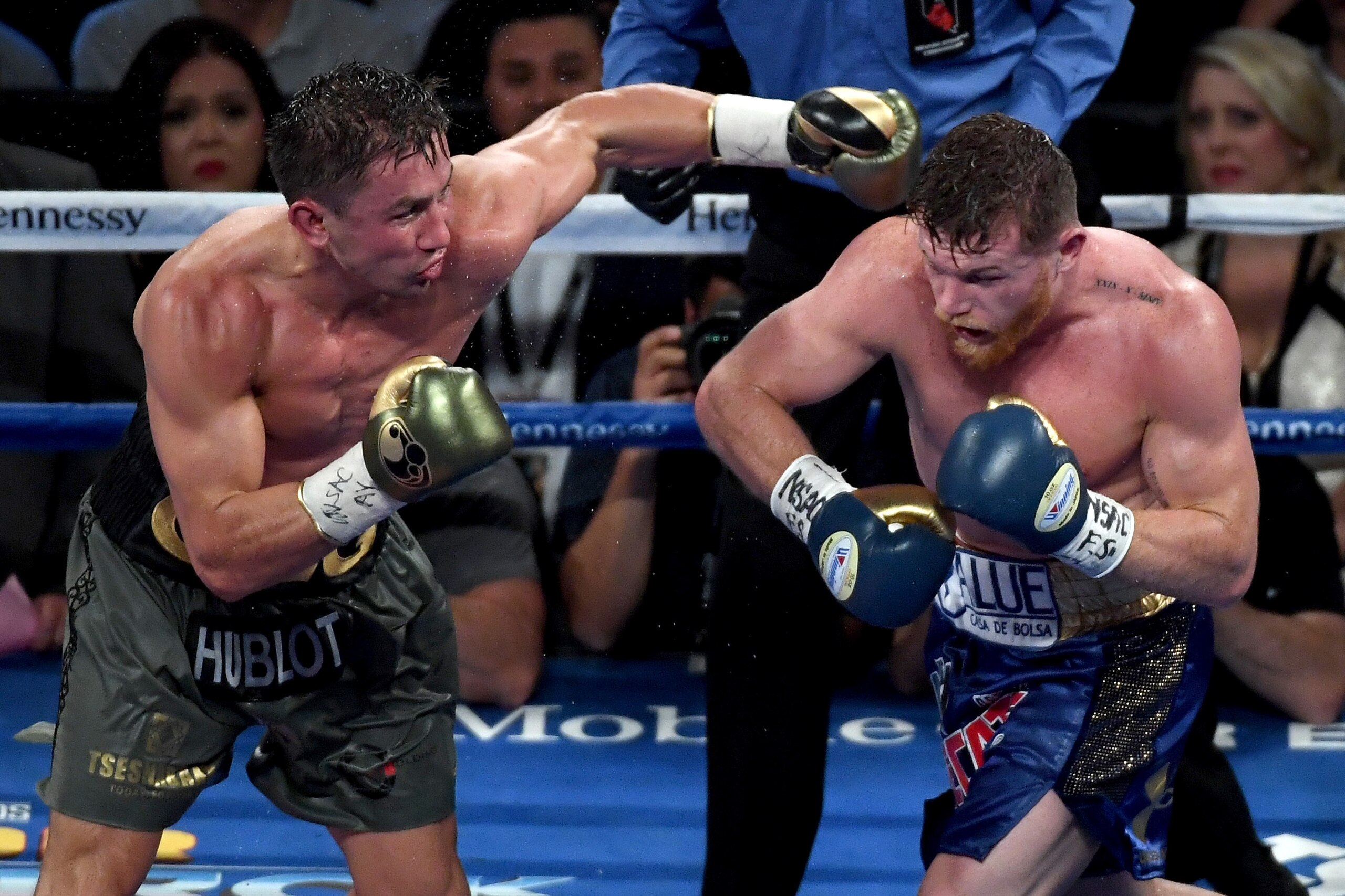LAS VEGAS, NV - SEPTEMBER 16:  (L-R) Gennady Golovkin throws a punch at Canelo Alvarez during their WBC, WBA and IBF middleweight championionship bout at T-Mobile Arena on September 16, 2017 in Las Vegas, Nevada.  (Photo by Ethan Miller/Getty Images)
