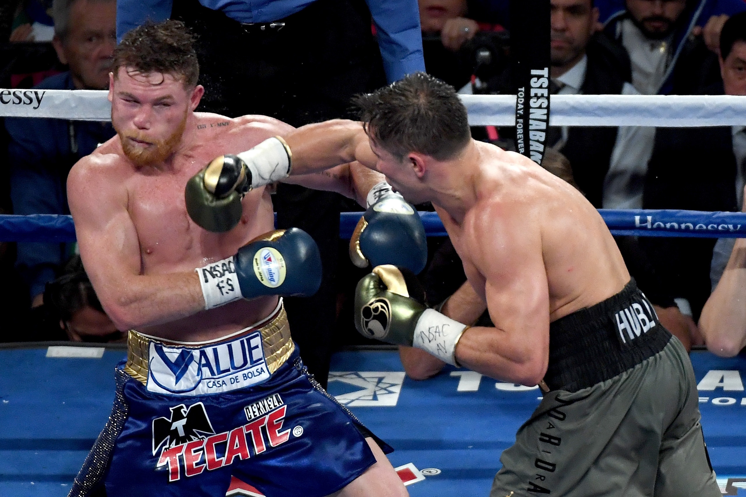 LAS VEGAS, NV - SEPTEMBER 16:  (R-L) Gennady Golovkin throws a punch at Canelo Alvarez during their WBC, WBA and IBF middleweight championionship bout at T-Mobile Arena on September 16, 2017 in Las Vegas, Nevada.  (Photo by Ethan Miller/Getty Images)