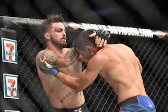 Sep 17, 2017; Pittsburgh, PA, USA; Mike Perry (Red Gloves) fights Alex Reyes (Blue Gloves) during UFC Fight Night at PPG PAINTS Arena. Mandatory Credit: Don Wright-USA TODAY Sports