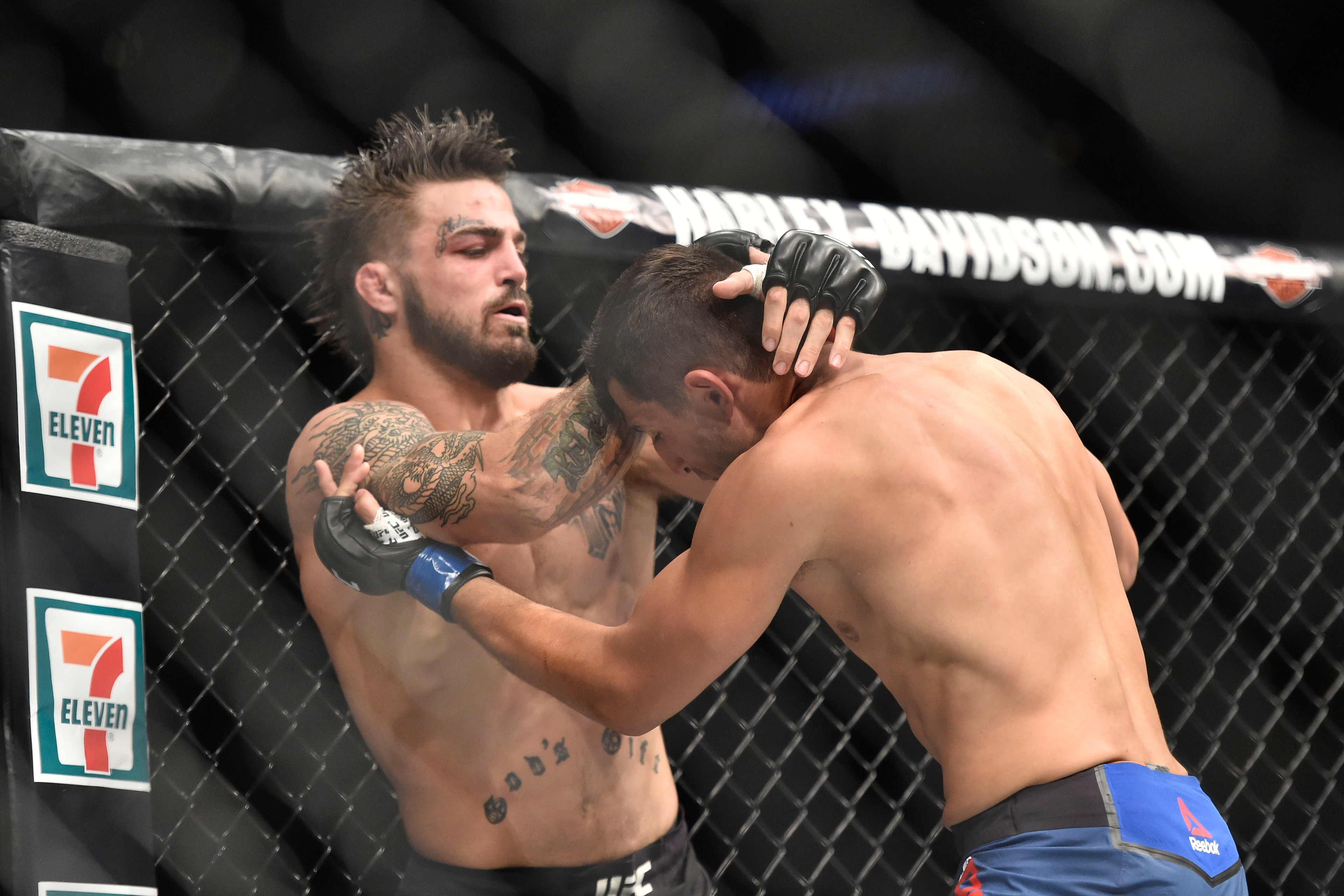 Sep 17, 2017; Pittsburgh, PA, USA; Mike Perry (Red Gloves) fights Alex Reyes (Blue Gloves) during UFC Fight Night at PPG PAINTS Arena. Mandatory Credit: Don Wright-USA TODAY Sports
