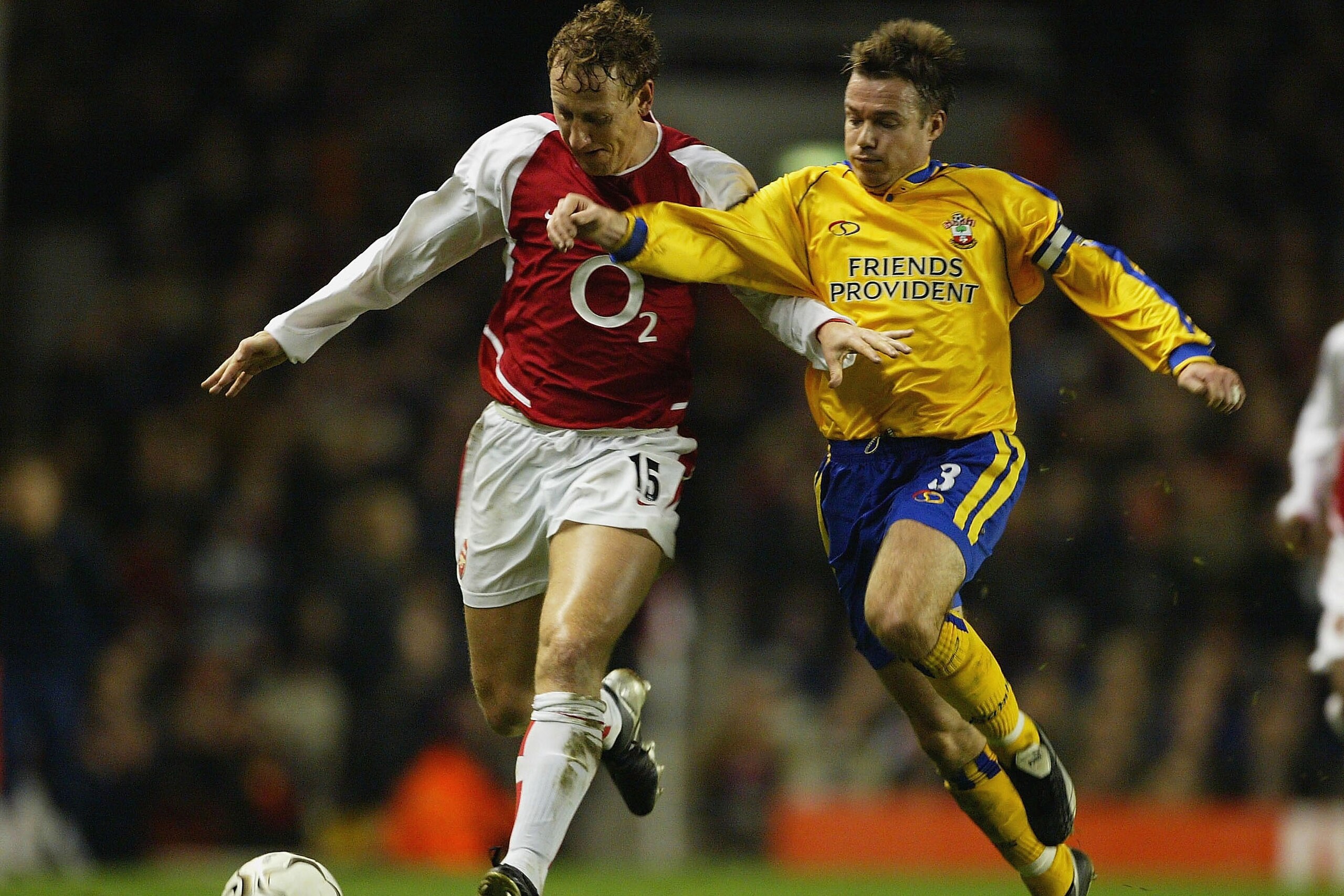 LONDON - FEBRUARY 10:  Ray Parlour of Arsenal battles for the ball with Graeme Le Saux of Southampton during the FA Barclaycard Premiership match between Arsenal and Southampton at Highbury on February 10, 2004 in London.  (Photo by Clive Mason/Getty Imag