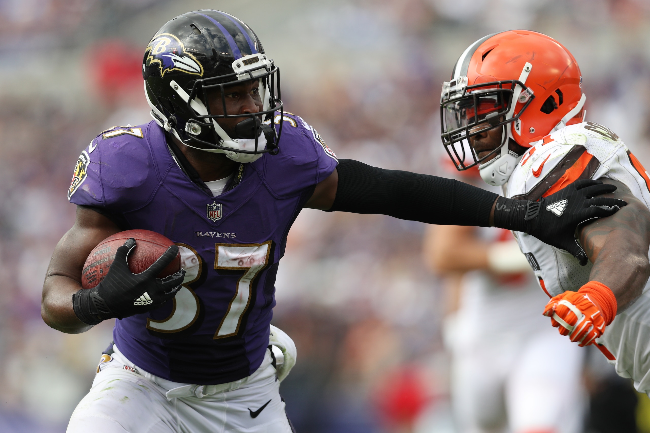 BALTIMORE, MD - SEPTEMBER 17: Running back Javorius Allen #37 of the Baltimore Ravens gets past outside linebacker Jamie Collins #51 of the Cleveland Browns in the third quarter at M&T Bank Stadium on September 17, 2017 in Baltimore, Maryland.  (Photo by 