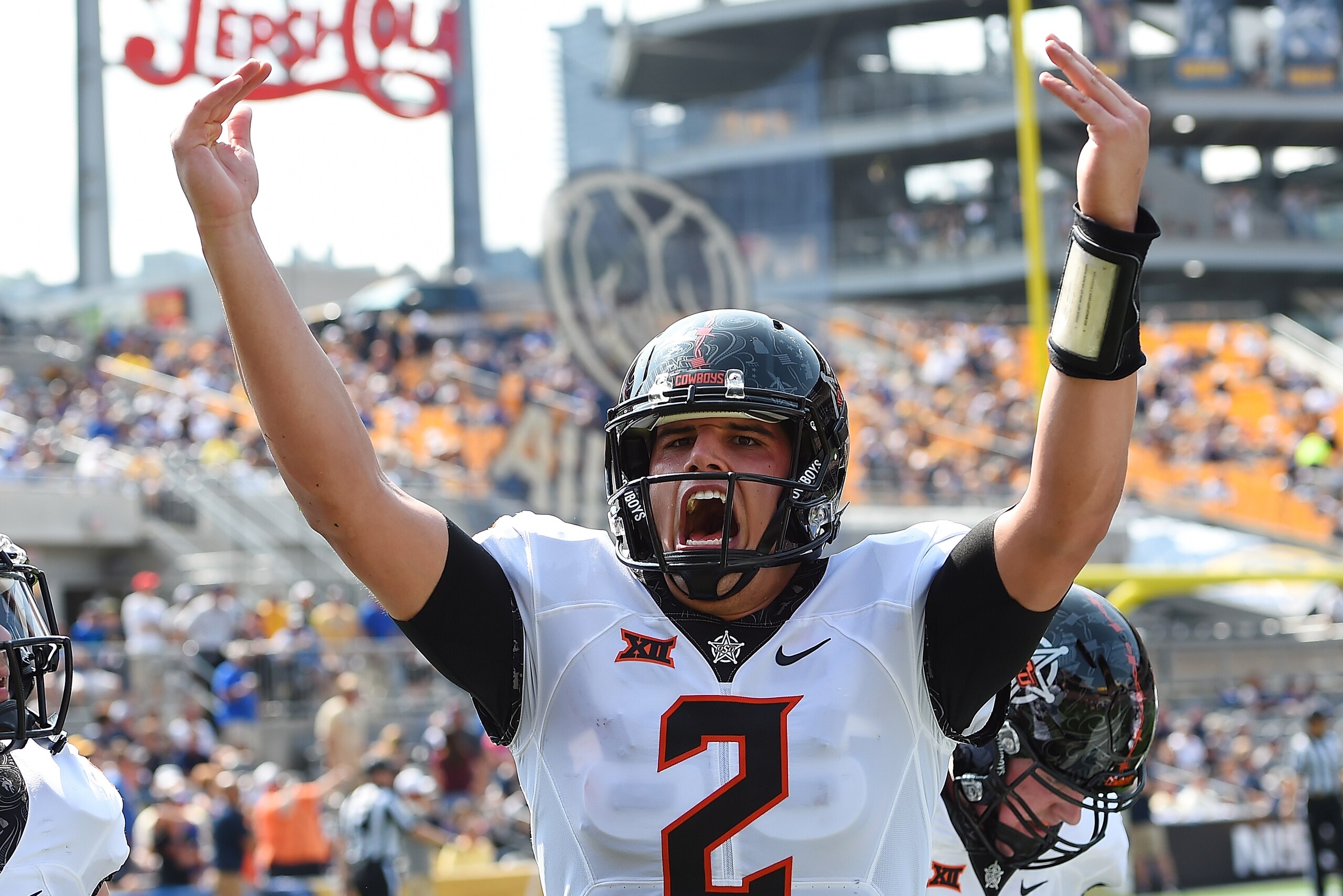 PITTSBURGH, PA - SEPTEMBER 16: Mason Rudolph #2 of the Oklahoma State Cowboys celebrates after a touchdown by Dillon Stoner #17 (not pictured) during the first quarter against the Pittsburgh Panthers at Heinz Field on September 16, 2017 in Pittsburgh, Pen