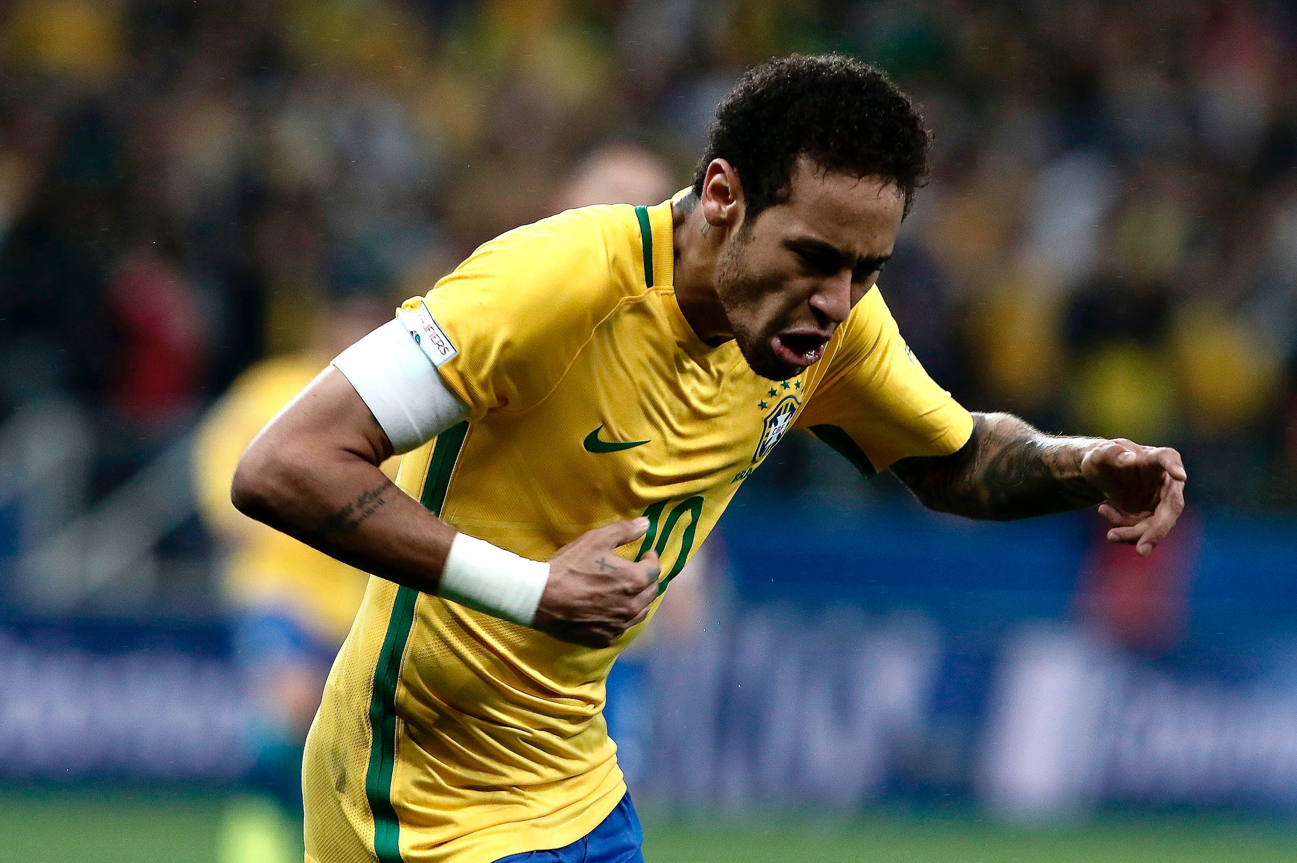 Brazil's forward Neymar celebrates during their 2018 FIFA World Cup qualifier football match against Paraguay in Sao Paulo, Brazil on March 28, 2017. / AFP PHOTO / Miguel SCHINCARIOL        (Photo credit should read MIGUEL SCHINCARIOL/AFP/Getty Images)