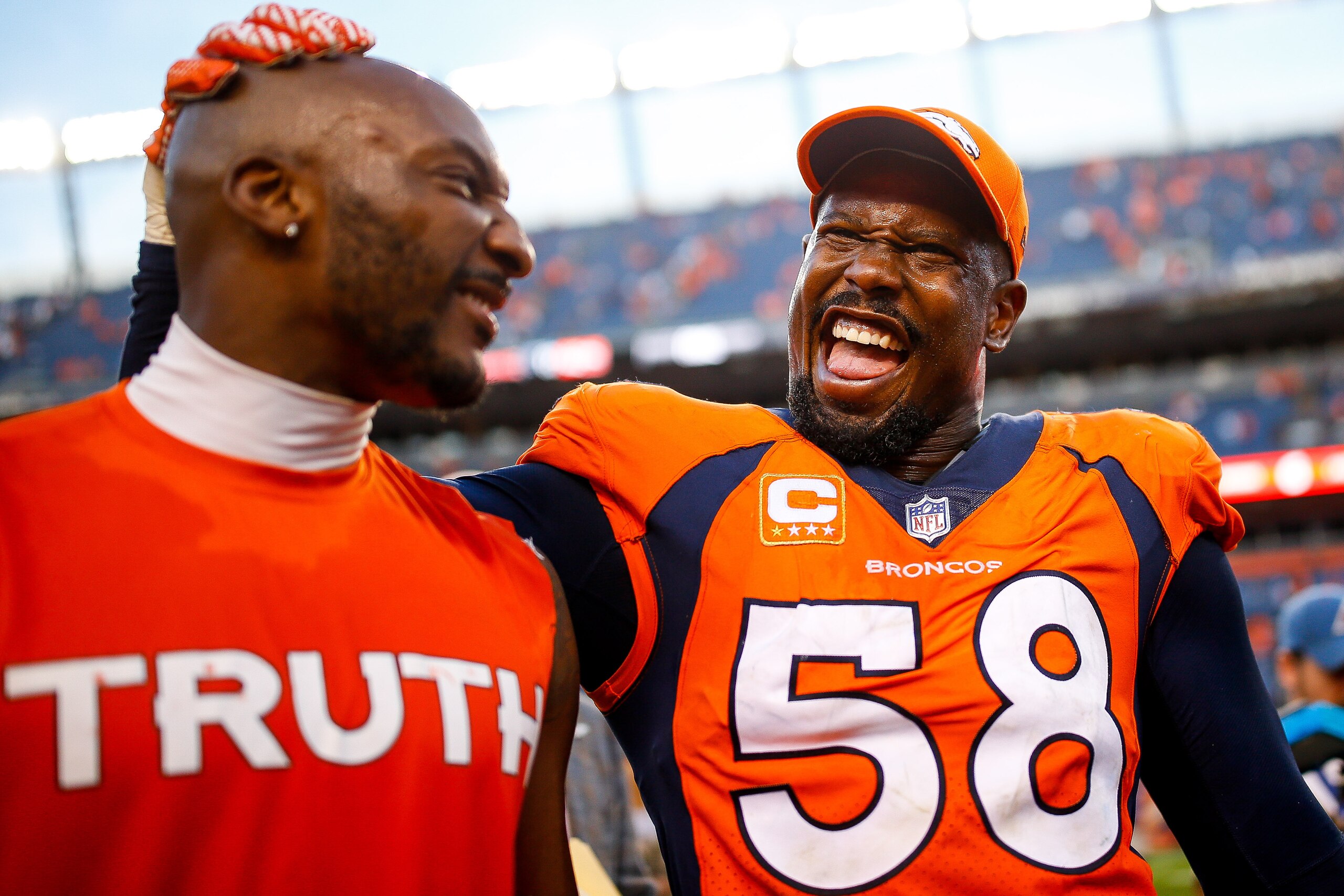DENVER, CO - SEPTEMBER 17: Outside linebacker Von Miller #58 of the Denver Broncos and cornerback Aqib Talib #21 of the Denver Broncos celebrate as they walk off the field after the Denver Broncos 42-17 win over the at Sports Authority Field at Mile Hig DENVER, CO - SEPTEMBER 17: Outside linebacker Von Miller #58 of the Denver Broncos and cornerback Aqib Talib #21 of the Denver Broncos celebrate as they walk off the field after the Denver Broncos 42-17 win over the at Sports Authority Field at Mile Hig