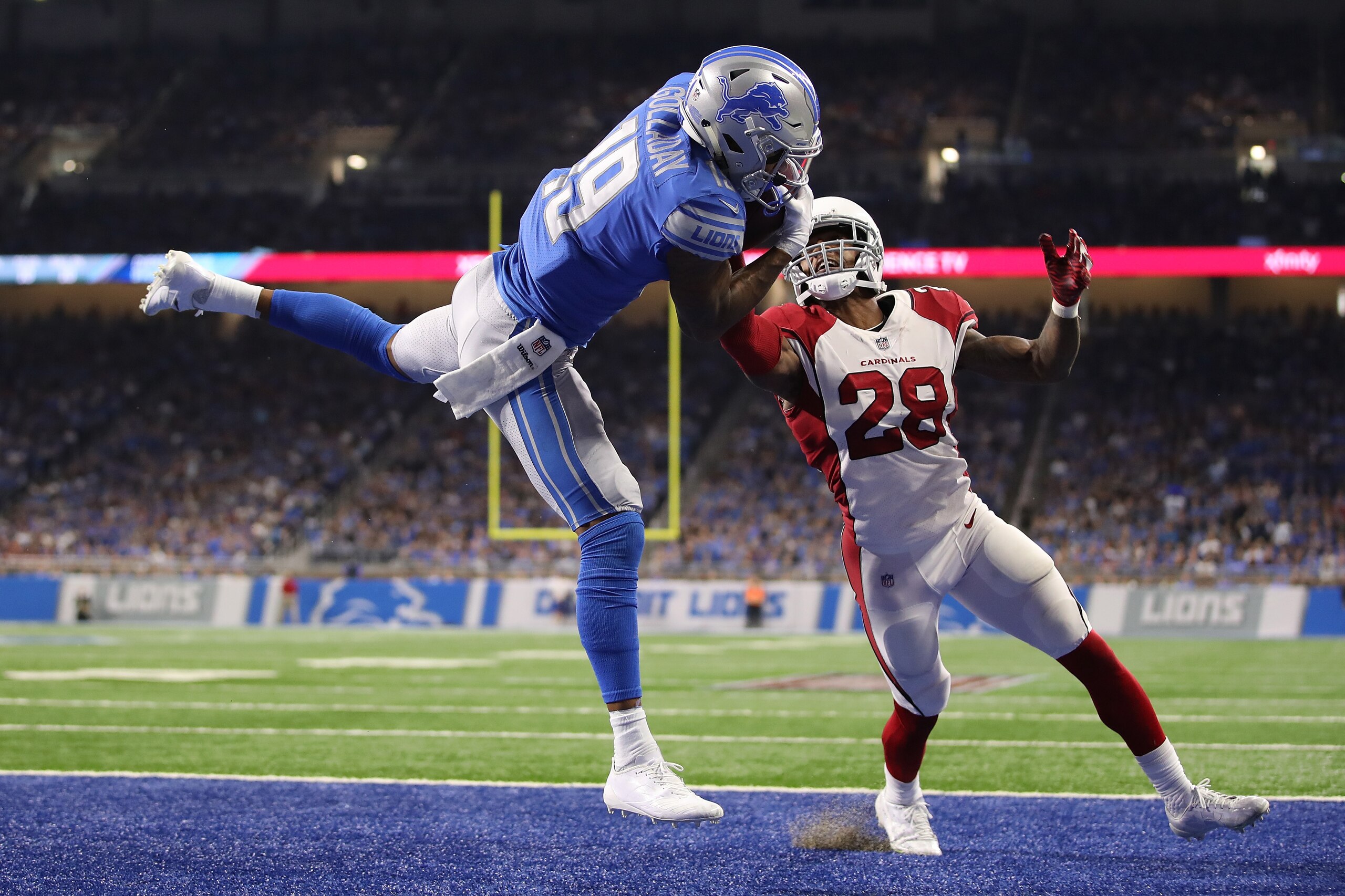DETROIT, MI - SEPTEMBER 10: Kenny Golladay #19 of the Detroit Lions catches a fourth quarter touchdown next to Justin Bethel #28 of the Arizona Cardinals at Ford Field on September 10, 2017 in Detroit, Michigan. Detroit won the game 35-23. (Photo by Grego