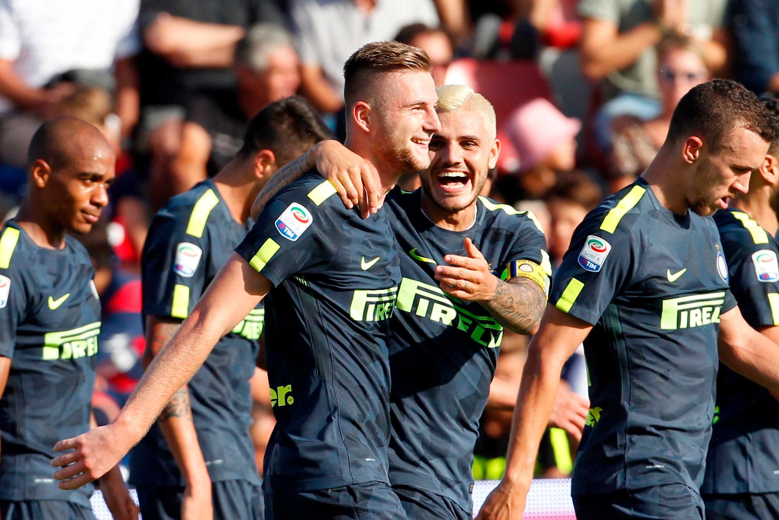 Inter Milan's Slovak defender Milan Skriniar (C-L) celebrates with his teammate Inter Milan's Argentinian forward Mauro Icardi during the Italian Serie A football match FC Crotone vs FC Internazionale Milano on September 16, 2017 at the Ezio Scida Stadium