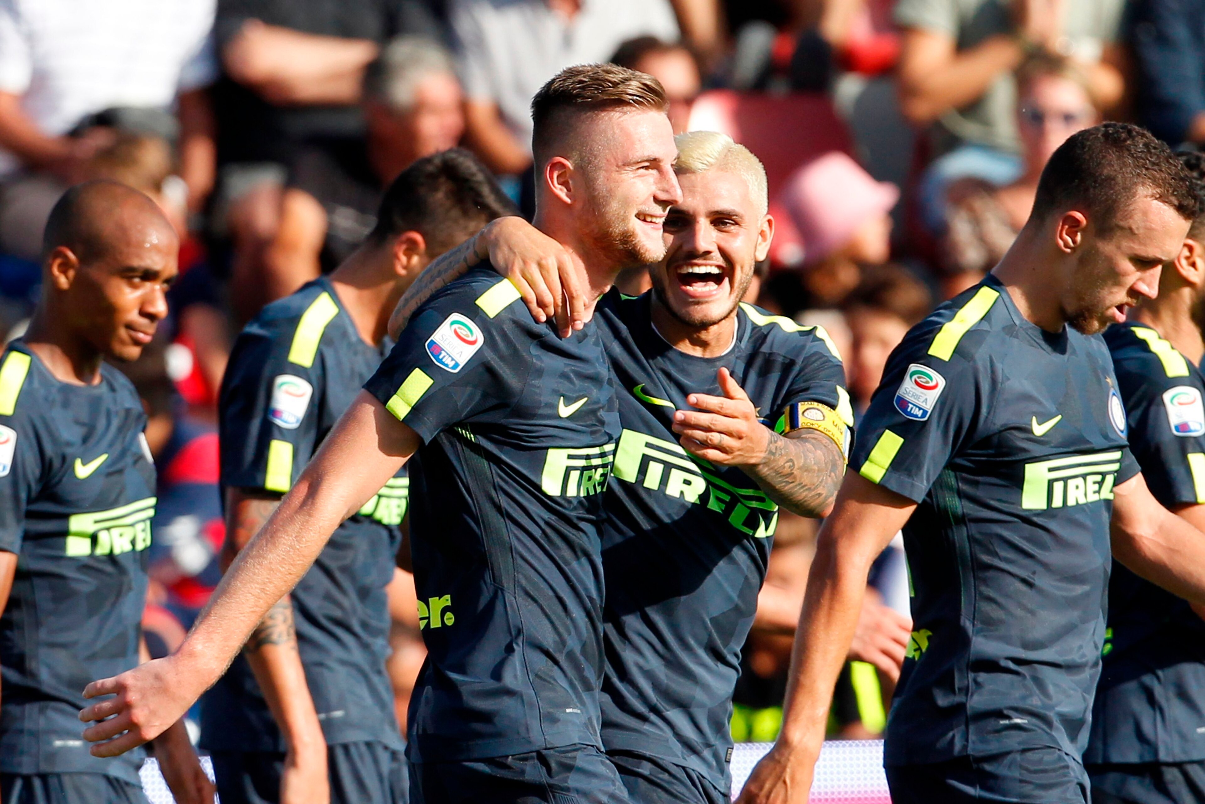 Inter Milan's Slovak defender Milan Skriniar (C-L) celebrates with his teammate Inter Milan's Argentinian forward Mauro Icardi during the Italian Serie A football match FC Crotone vs FC Internazionale Milano on September 16, 2017 at the Ezio Scida Stadium