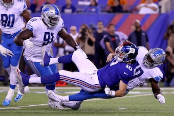 EAST RUTHERFORD, NJ - SEPTEMBER 18:  Jarrad Davis #40 of the Detroit Lions sacks  Eli Manning #10 of the New York Giants in the first half during their game at MetLife Stadium on September 18, 2017 in East Rutherford, New Jersey.  (Photo by Al Bello/Getty