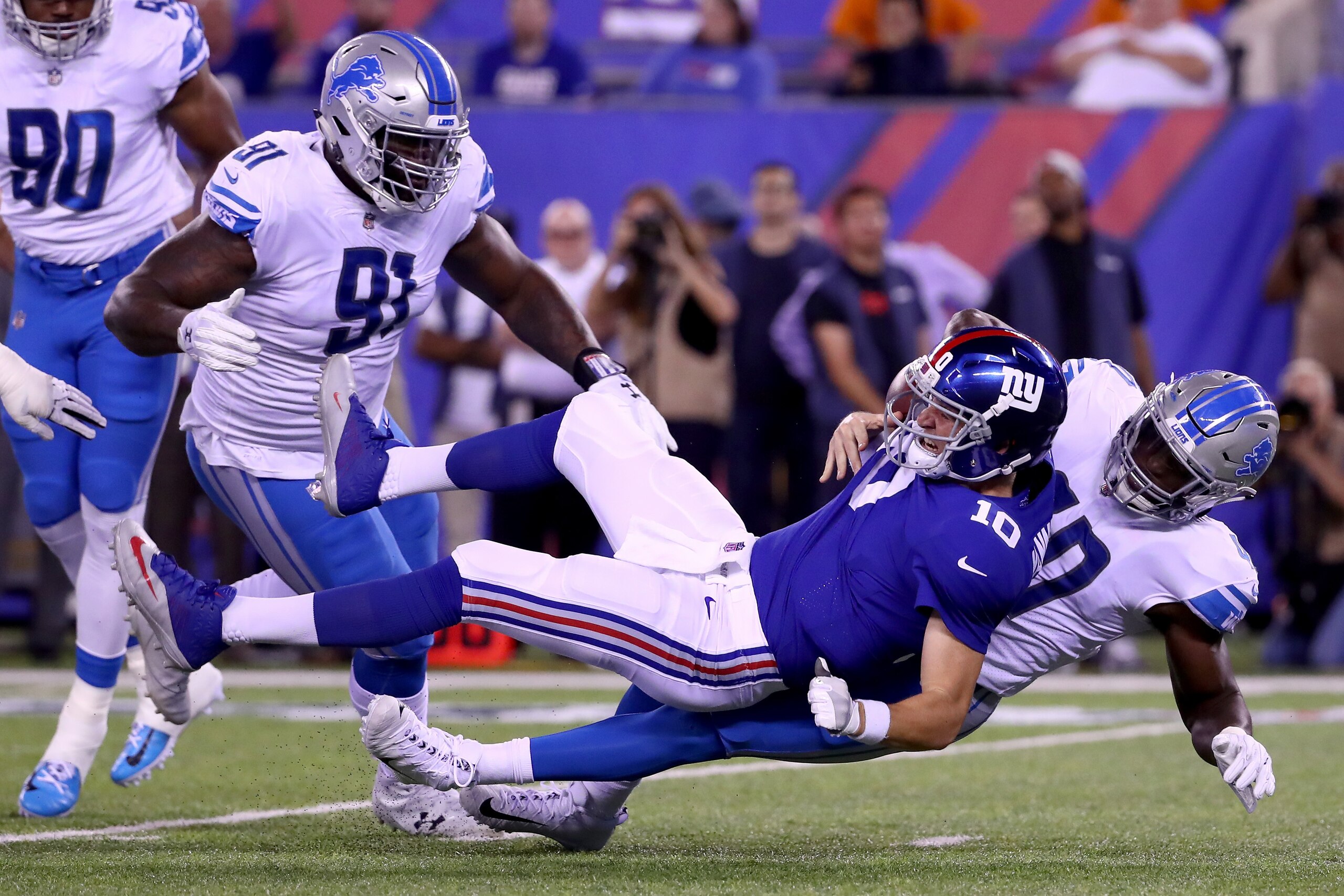 EAST RUTHERFORD, NJ - SEPTEMBER 18:  Jarrad Davis #40 of the Detroit Lions sacks  Eli Manning #10 of the New York Giants in the first half during their game at MetLife Stadium on September 18, 2017 in East Rutherford, New Jersey.  (Photo by Al Bello/Getty