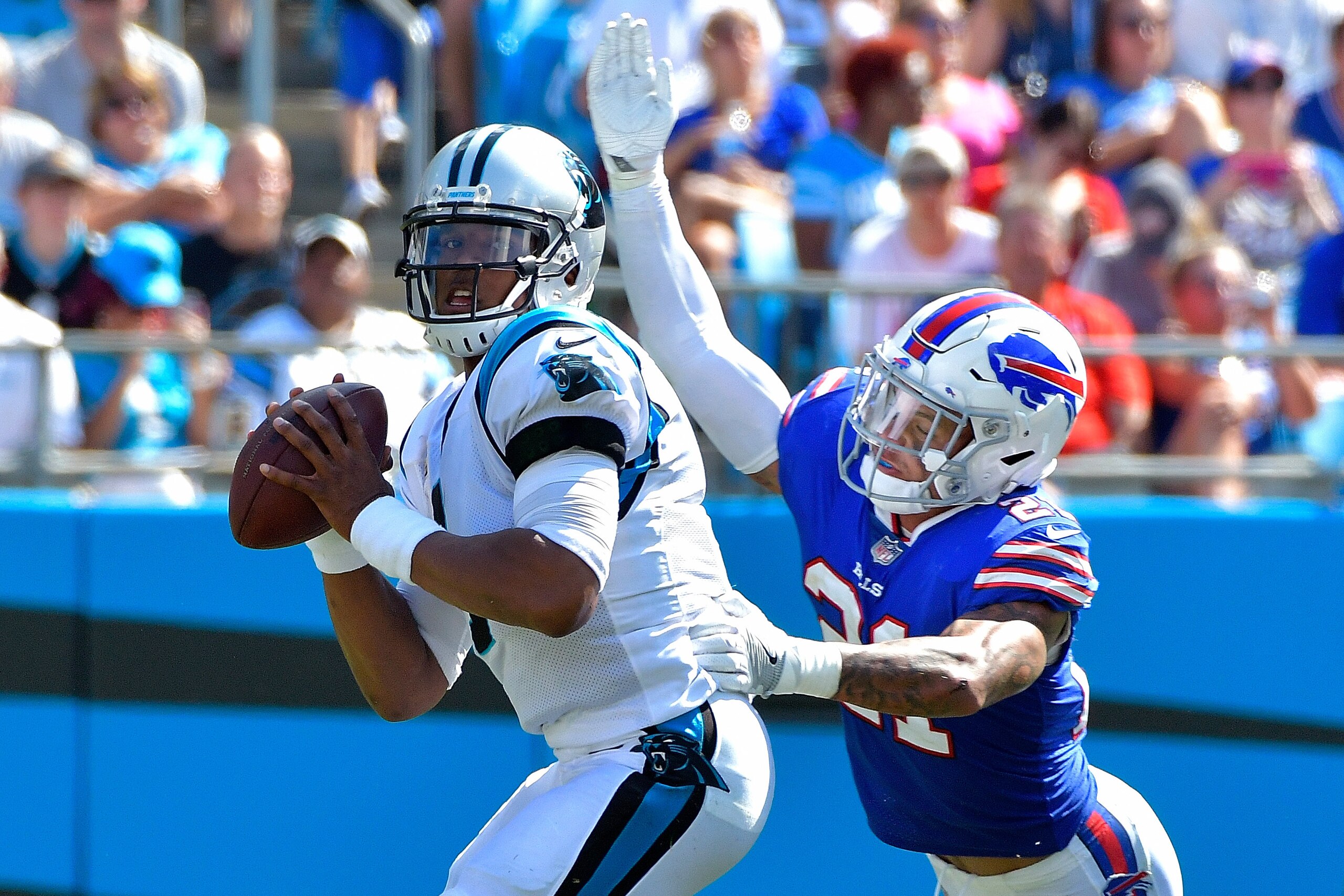 CHARLOTTE, NC - SEPTEMBER 17:  Jordan Poyer #21 of the Buffalo Bills pressures Cam Newton #1 of the Carolina Panthers during their game at Bank of America Stadium on September 17, 2017 in Charlotte, North Carolina.  (Photo by Grant Halverson/Getty Images)