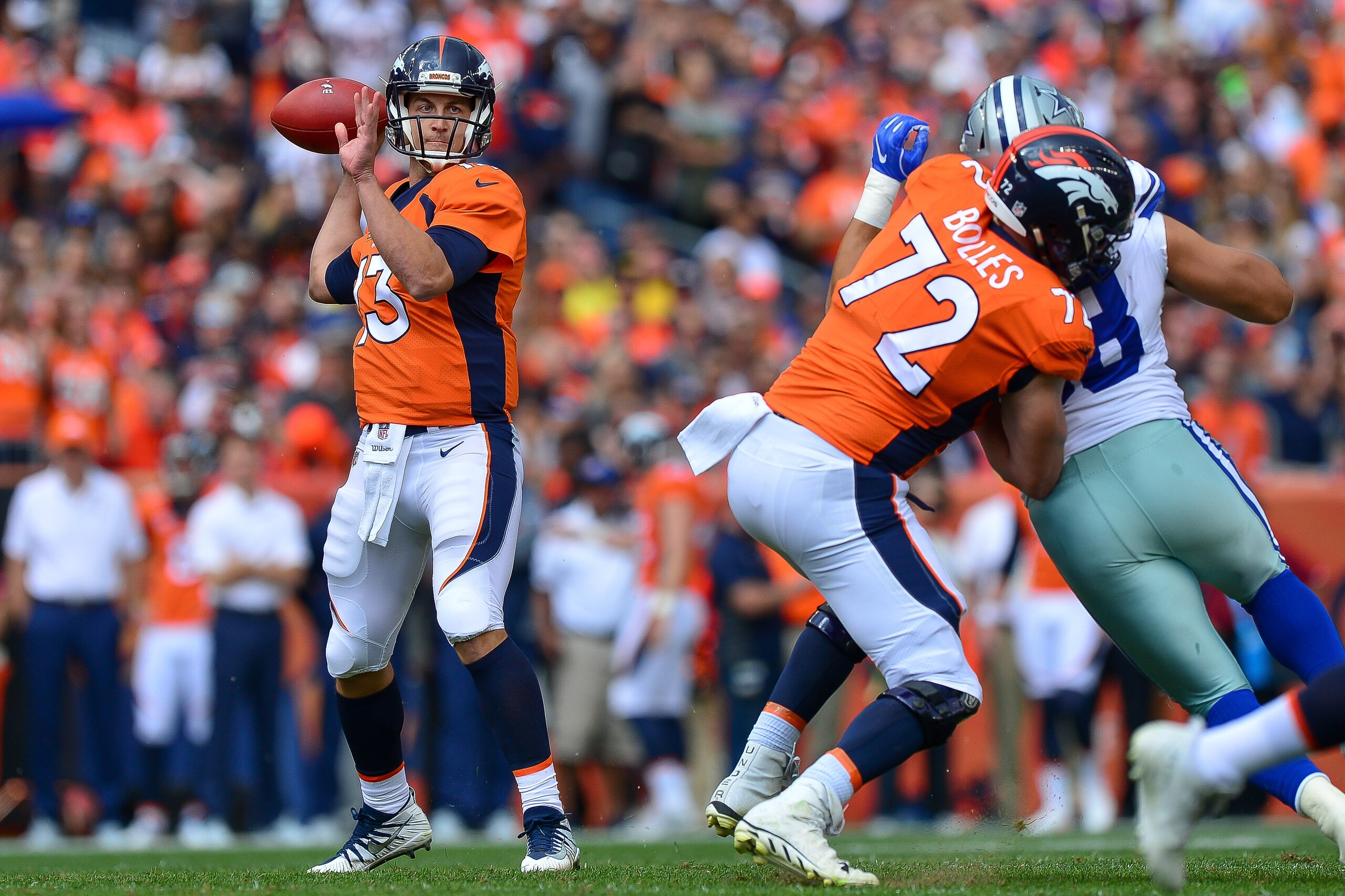 DENVER, CO - SEPTEMBER 17:  Quarterback Trevor Siemian #13 of the Denver Broncos passes against the Dallas Cowboys in the first quarter of a game at Sports Authority Field at Mile High on September 17, 2017 in Denver, Colorado. (Photo by Dustin Bradford/G