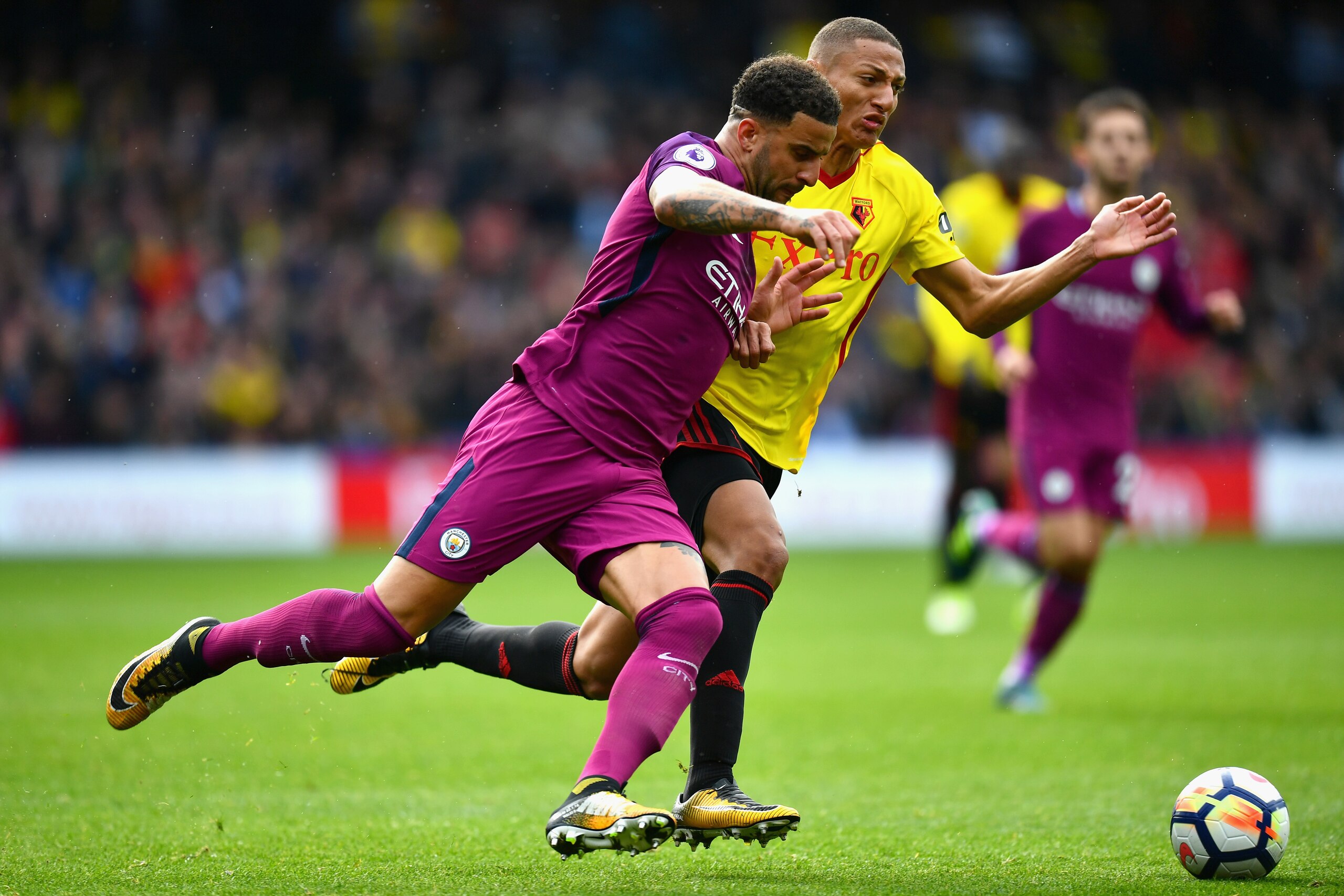 WATFORD, ENGLAND - SEPTEMBER 16: Kyle Walker of Manchester City and Richarlison de Andrade of Watford battle for possession during the Premier League match between Watford and Manchester City at Vicarage Road on September 16, 2017 in Watford, England.  (P