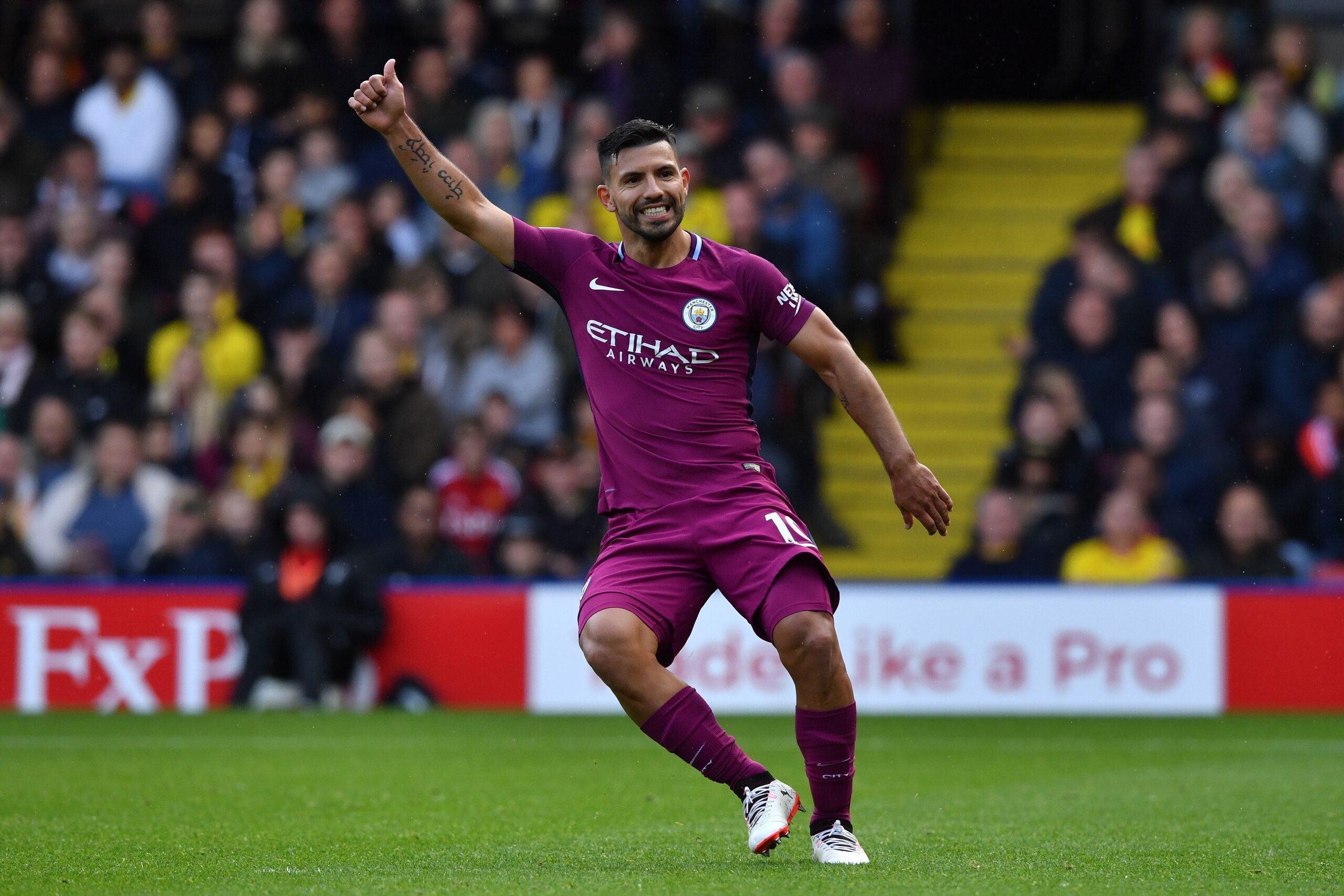 Manchester City's Argentinian striker Sergio Aguero signals a good pass to a teammate during the English Premier League football match between Watford and Manchester City at Vicarage Road Stadium in Watford, north of London on September 16, 2017. / AFP PH
