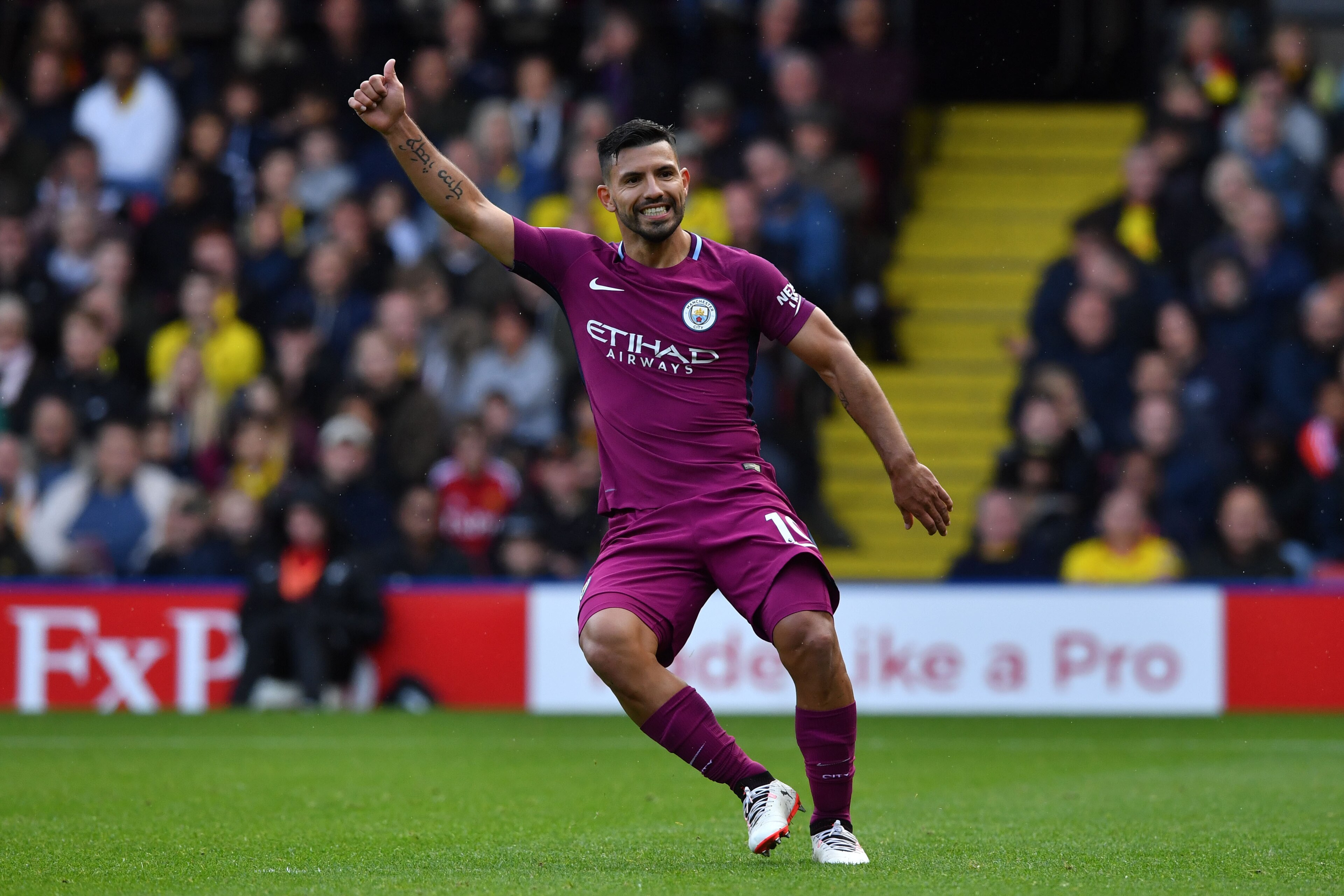 Manchester City's Argentinian striker Sergio Aguero signals a good pass to a teammate during the English Premier League football match between Watford and Manchester City at Vicarage Road Stadium in Watford, north of London on September 16, 2017. / AFP PH