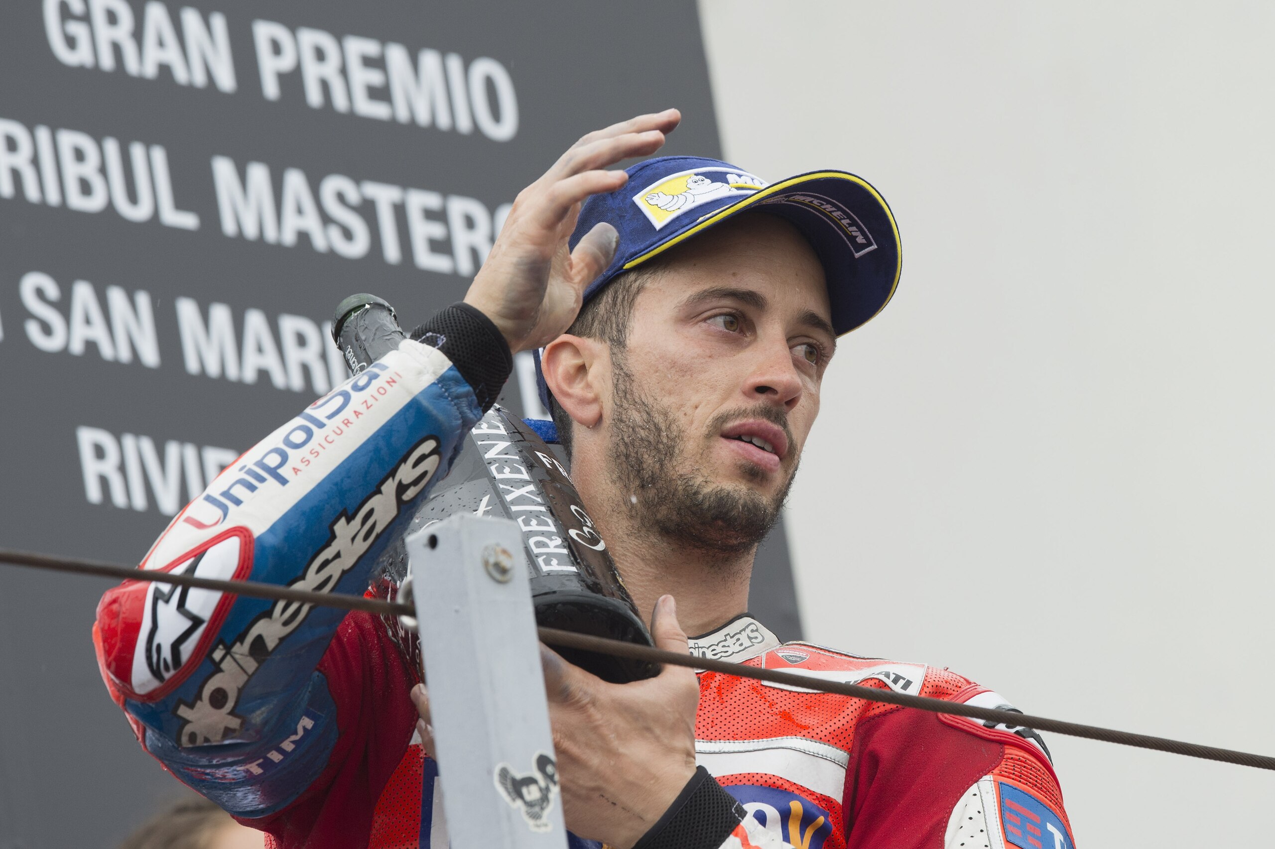 MISANO ADRIATICO, ITALY - SEPTEMBER 10:  Andrea Dovizioso of Italy and Ducati Team speaks celebrates on the podium at the end of the MotoGP Race during the MotoGP of San Marino - Race at Misano World Circuit on September 10, 2017 in Misano Adriatico, Ital