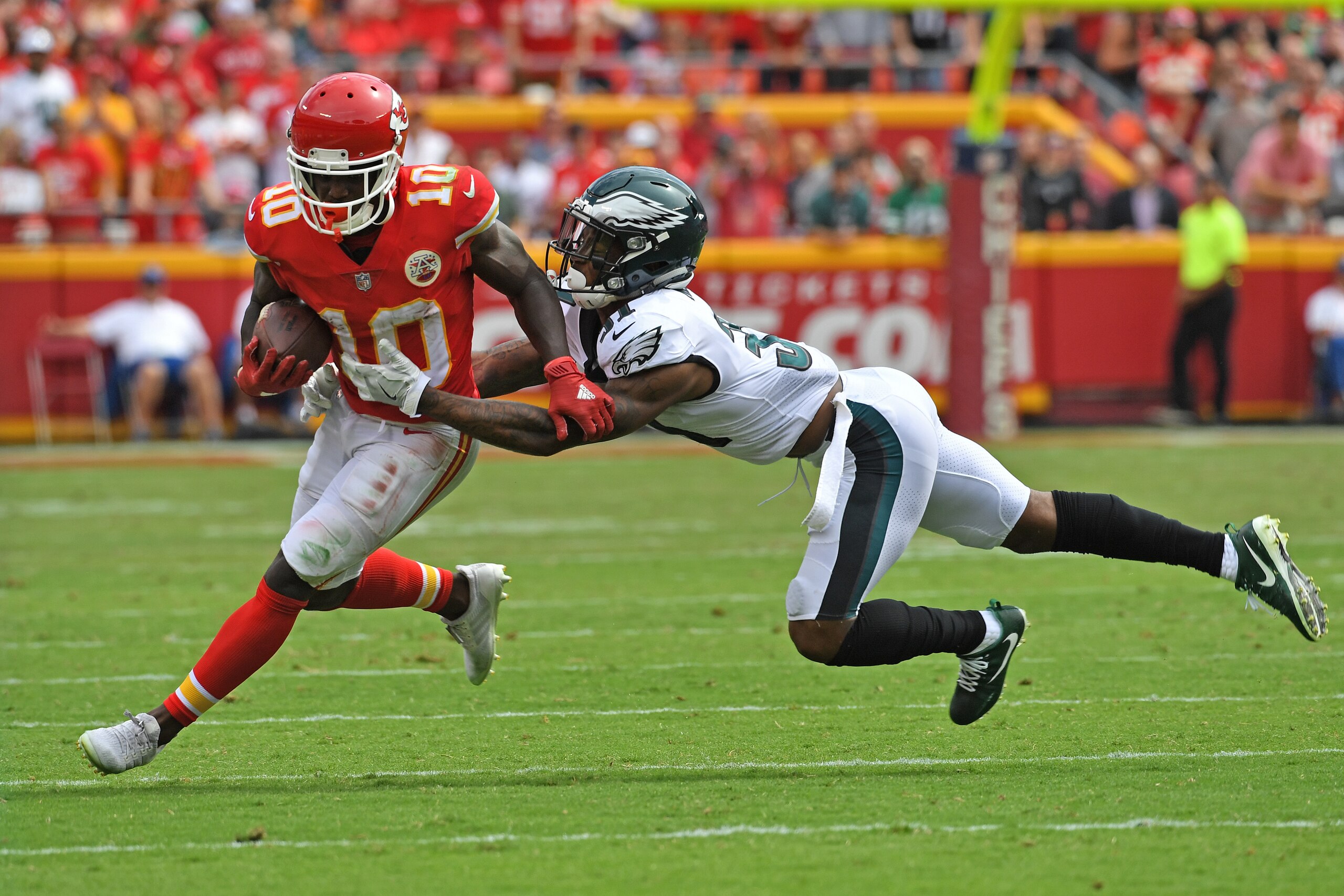 KANSAS CITY, MO - SEPTEMBER 17:  Defensive back Jalen Mills #31 of the Philadelphia Eagles tackles wide receiver Tyreek Hill #10 of the Kansas City Chiefs during the second half on September 17, 2017 at Arrowhead Stadium in Kansas City, Missouri.  (Photo 