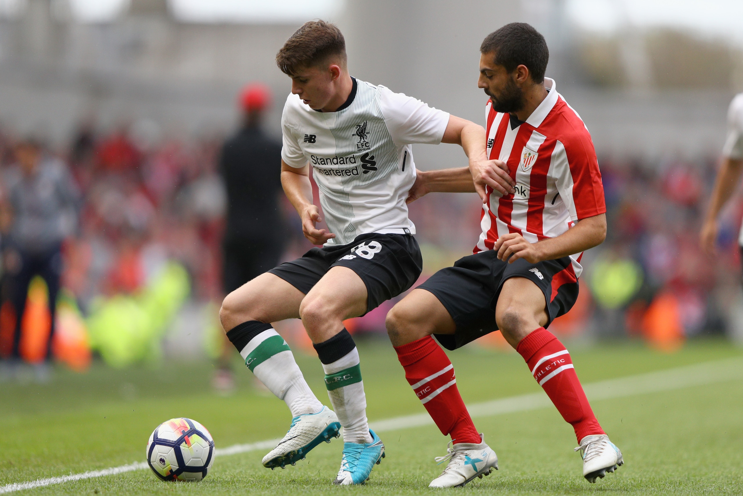 DUBLIN, IRELAND - AUGUST 5: Asier Villalibre of Athletic Club and Ben Woodburn of Liverpool battle for possession during the Pre Season Friendly match between Liverpool and Athletic Club at Aviva Stadium on August 5, 2017 in Dublin, Ireland.  (Photo by Ia