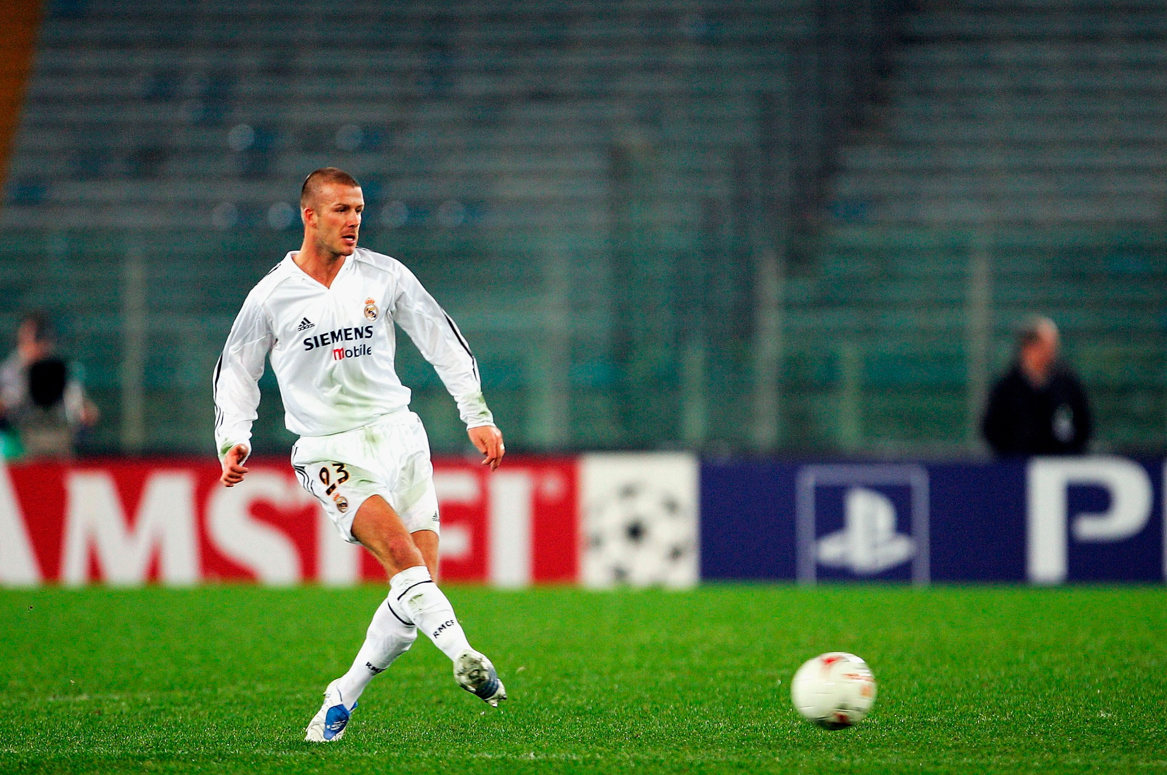 ROME, ITALY -  DECEMBER 8:  David Beckham of Real Madrid passes in an empty stadium during the UEFA Champion's League group B match between AS Roma and Real Madrid on December 8, 2004 at the Stadio Olympico in Rome, Italy. (Photo by Mike Hewitt/Getty Imag
