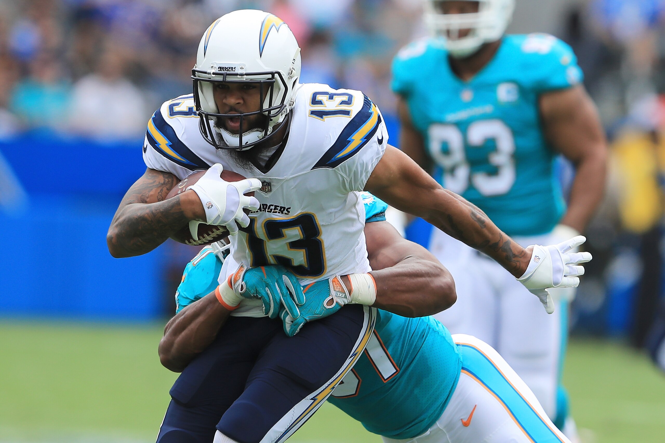 CARSON, CA - SEPTEMBER 17:  Michael Thomas #31 of the Miami Dolphins tackles Keenan Allen #13 of the Los Angeles Chargers during the NFL game at the StubHub Center on September 17, 2017 in Carson, California.  (Photo by Sean M. Haffey/Getty Images)