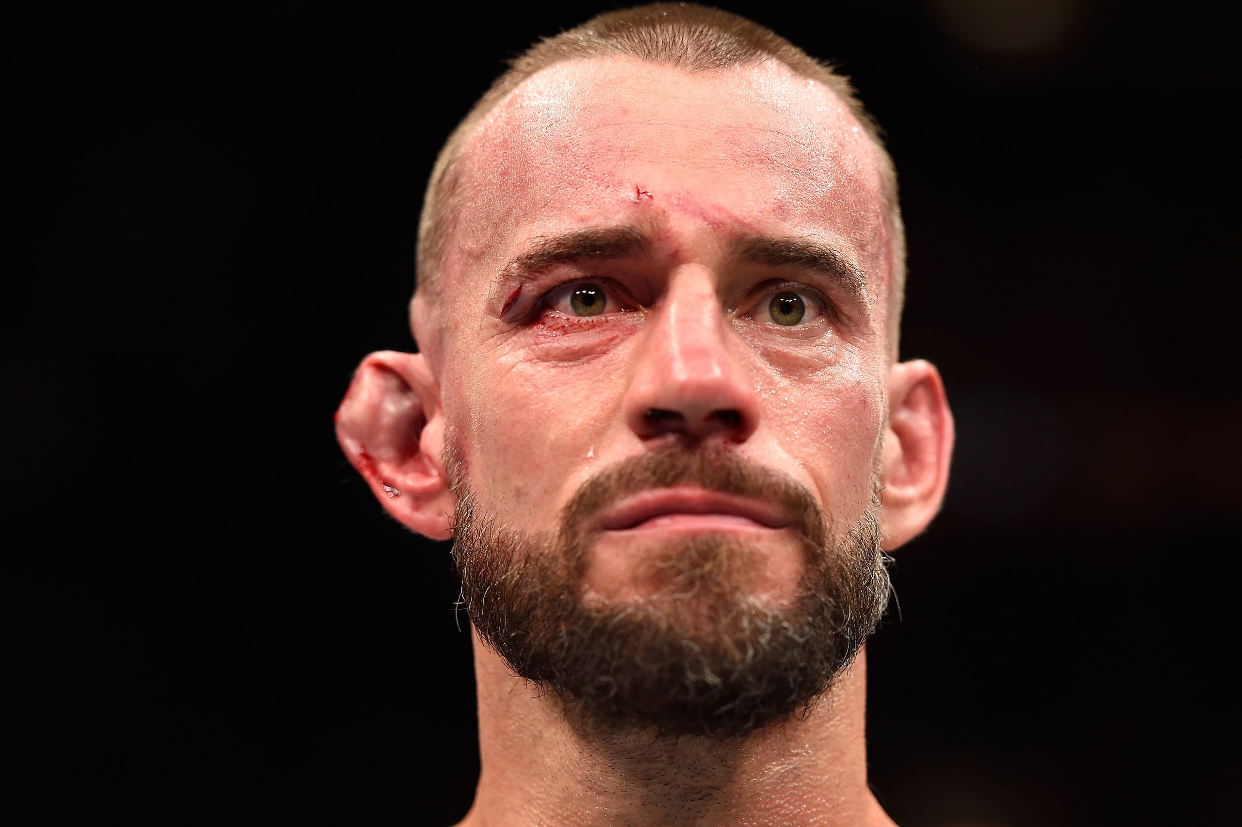CLEVELAND, OH - SEPTEMBER 10: Phil 'CM Punk' Brooks stands in the Octagon after being defeated by Mickey Gall by submission in their welterweight bout during the UFC 203 event at Quicken Loans Arena on September 10, 2016 in Cleveland, Ohio. (Photo by Jos CLEVELAND, OH - SEPTEMBER 10: Phil 'CM Punk' Brooks stands in the Octagon after being defeated by Mickey Gall by submission in their welterweight bout during the UFC 203 event at Quicken Loans Arena on September 10, 2016 in Cleveland, Ohio. (Photo by Jos