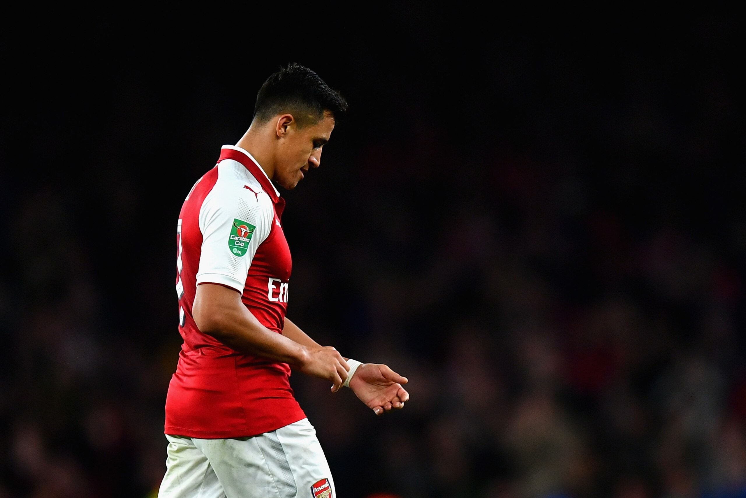 LONDON, ENGLAND - SEPTEMBER 20: Alexis Sanchez of Arsenal walks off dejected after the Carabao Cup Third Round match between Arsenal and Doncaster Rovers at Emirates Stadium on September 20, 2017 in London, England.  (Photo by Dan Mullan/Getty Images)