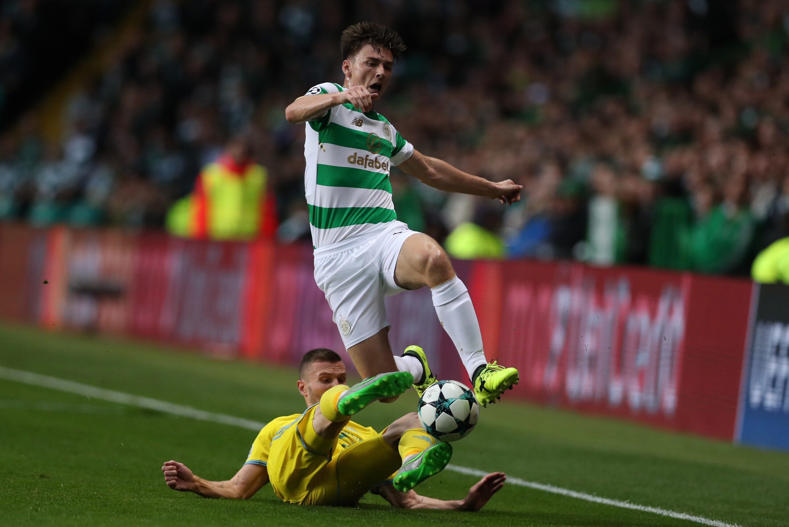 GLASGOW, SCOTLAND - AUGUST 16: Igor Shitov of FC Astana vies with Kieran Tierney of Celtic during the UEFA Champions League Qualifying Play-Offs Round First Leg match between Celtic FC and FK Astana at Celtic Park on August 16, 2017 in Glasgow, United Kin